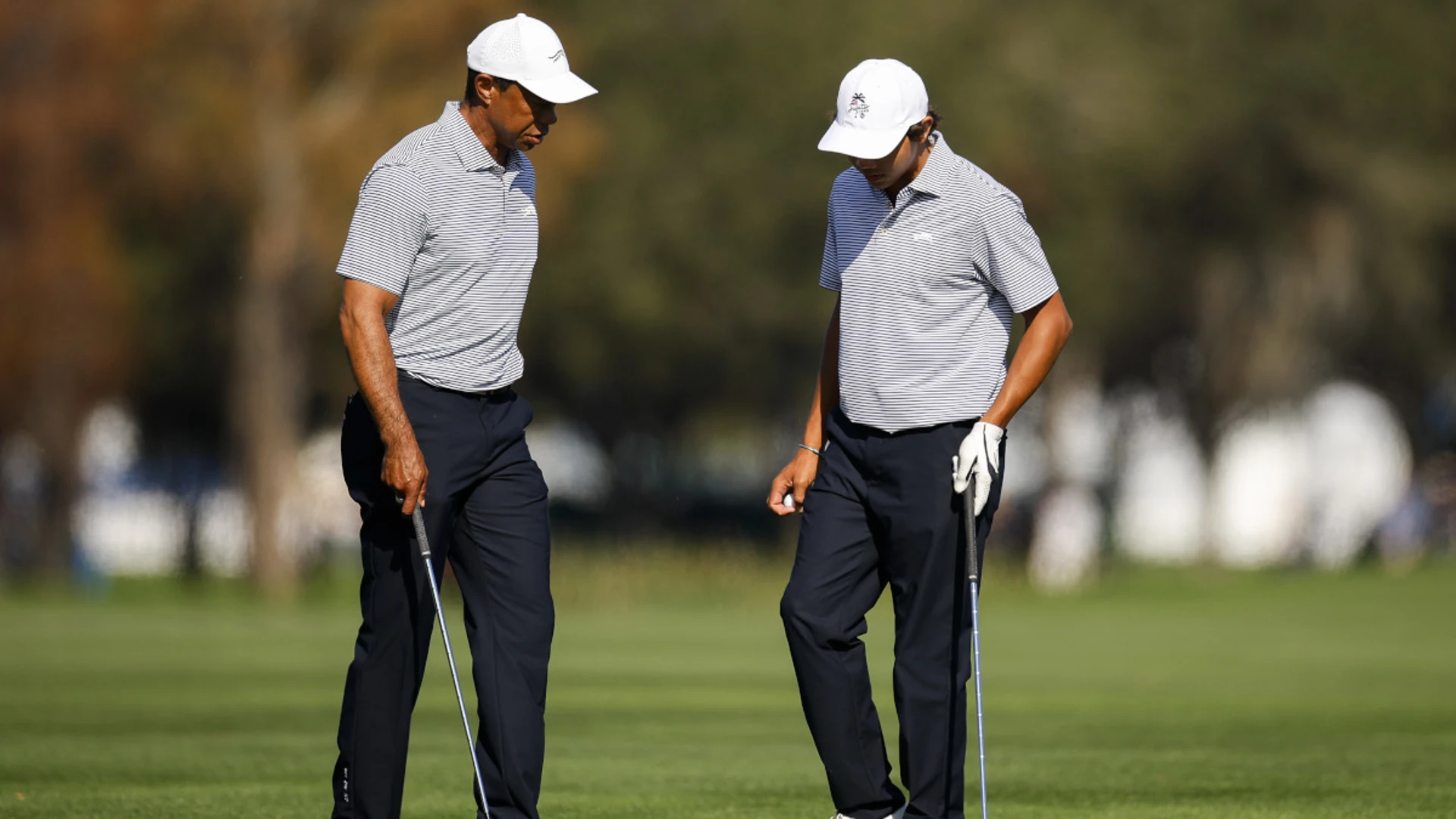 Tiger Woods and son Charlie share halfway lead in family event