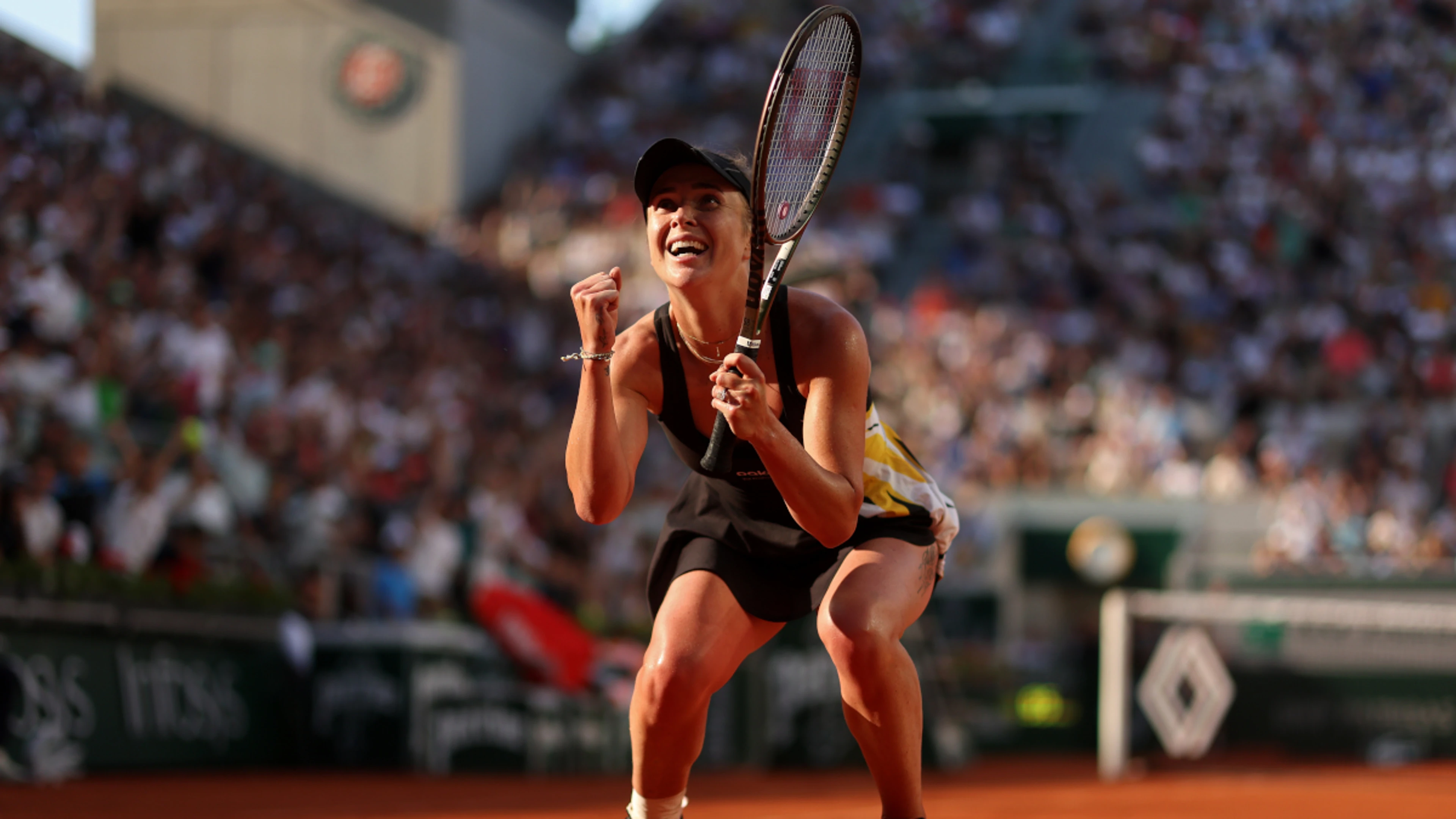 Two for the price of one: Ukrainian spectator has oversized flag cut in two