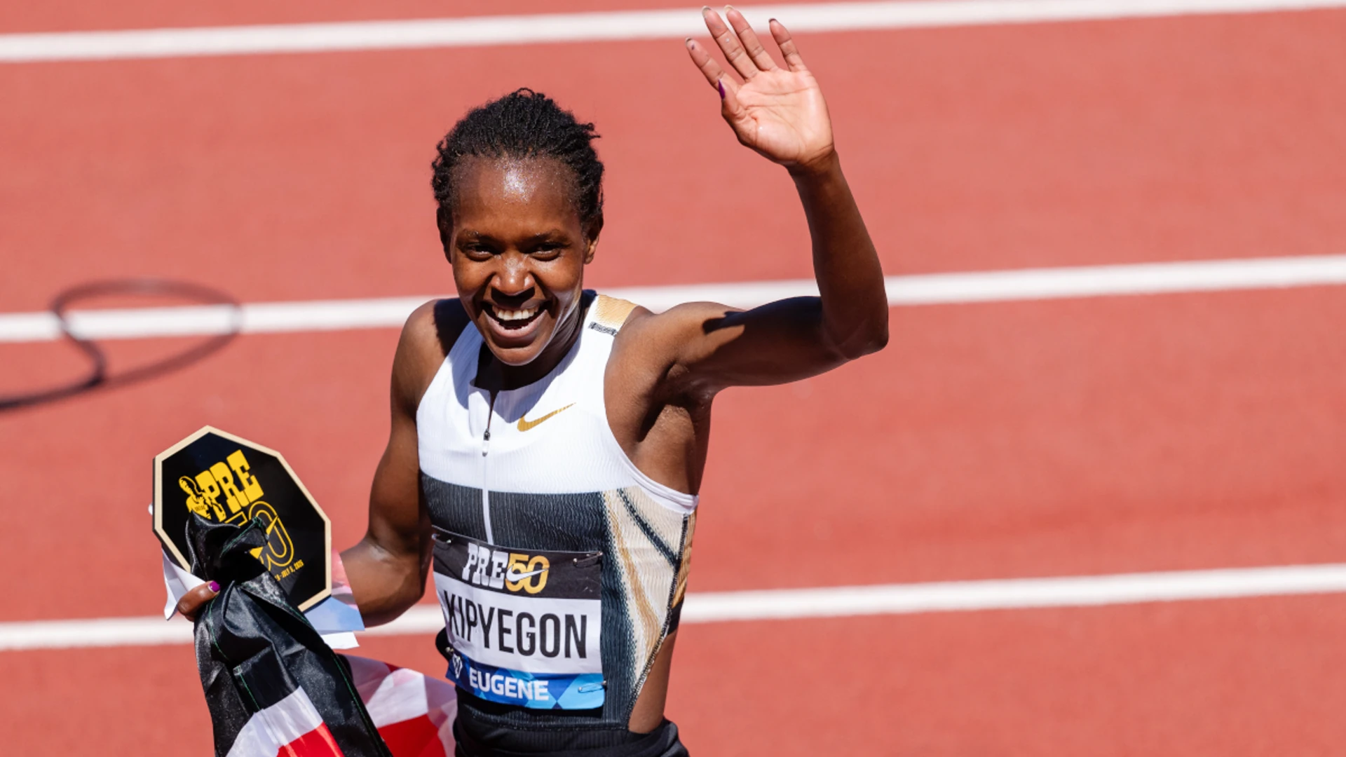 Kipyegon says a woman will run a sub-four minute mile
