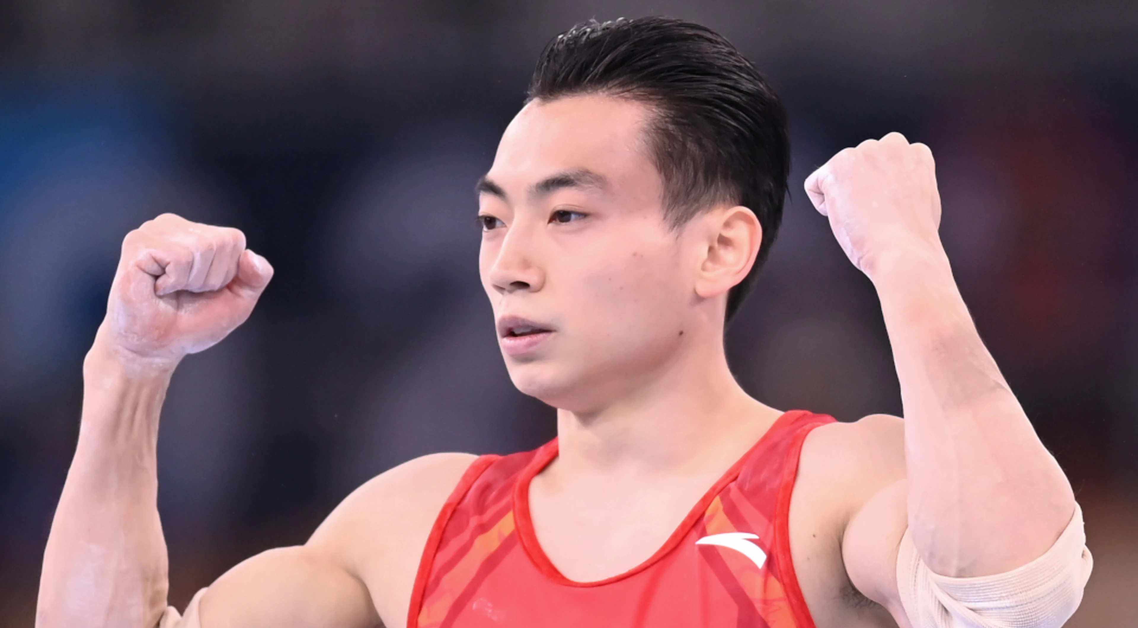 China's Zou wins gold in men's parallel bars