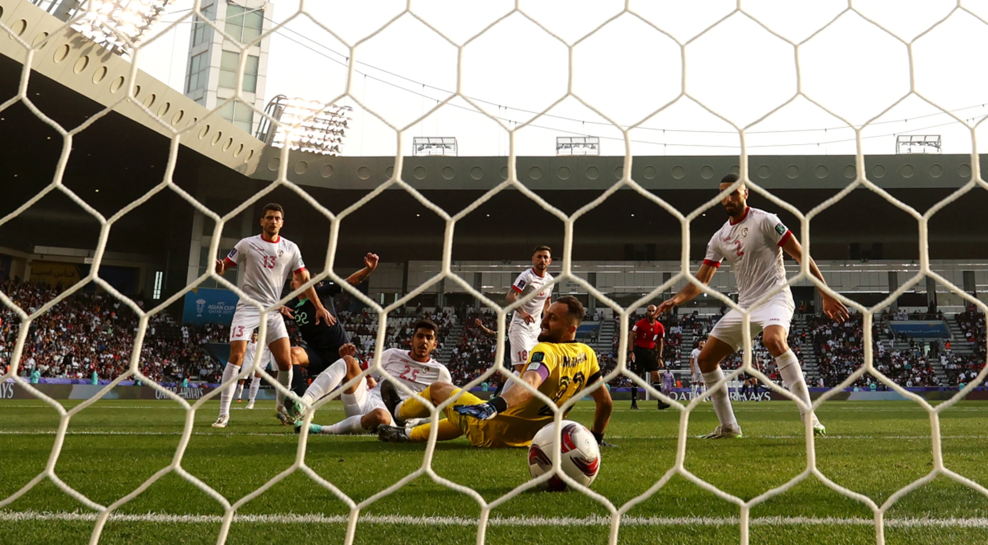 Australia edge Syria to reach Asian Cup knockouts