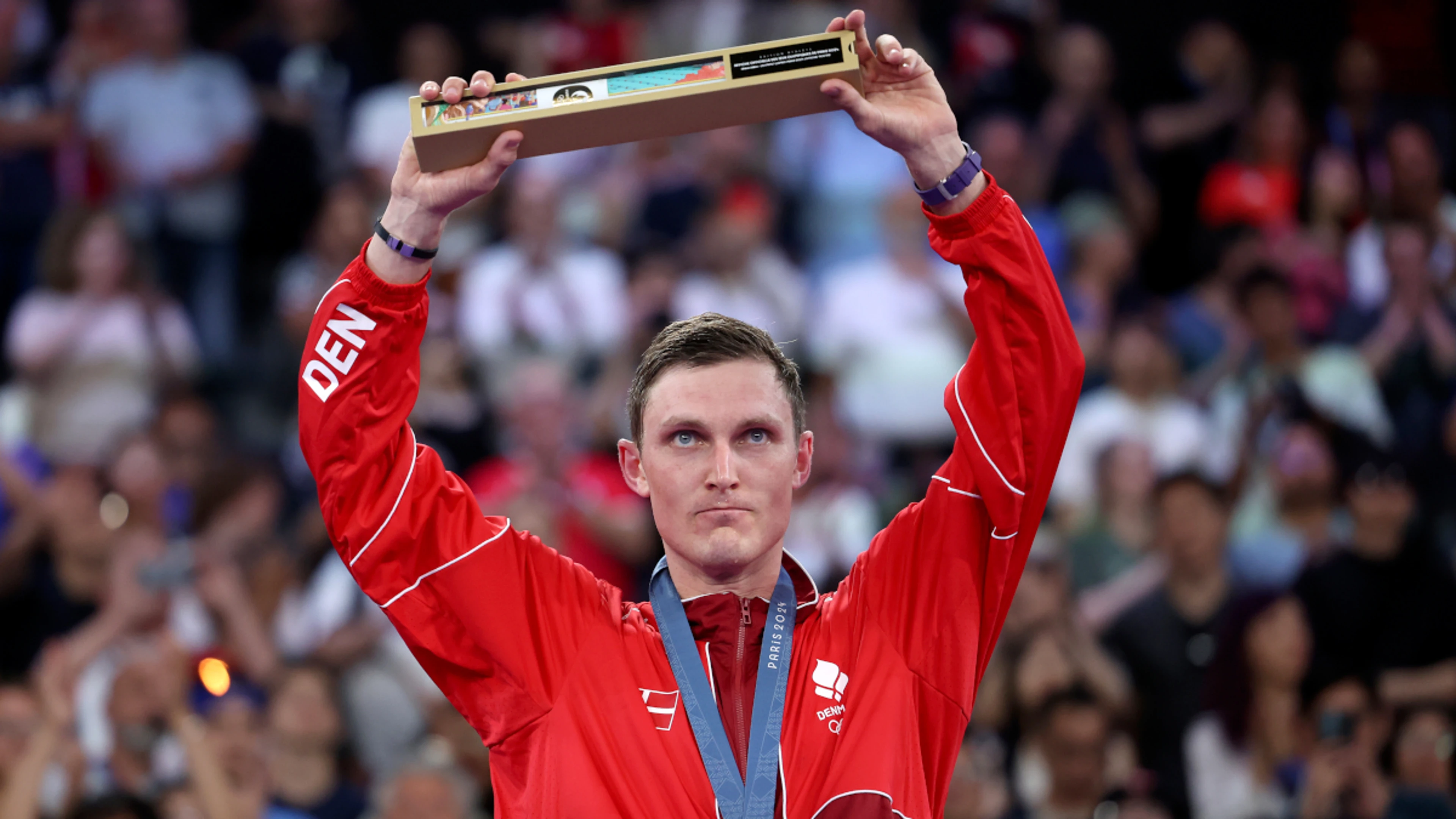 Denmark's Axelsen retains mens' Olympic badminton title