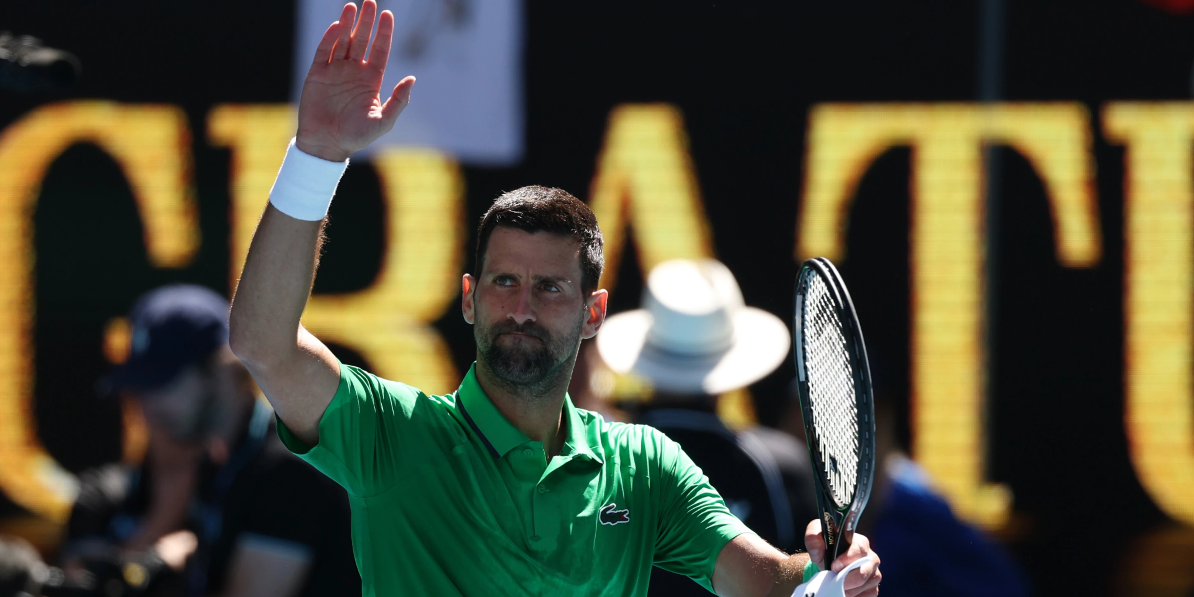 Djokovic eases into Melbourne third round - with help from a tree