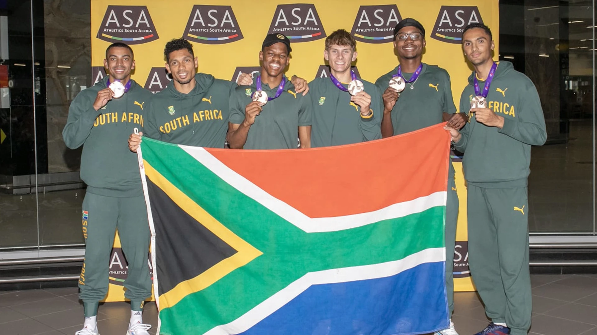 SA athletics team returns home from world champs