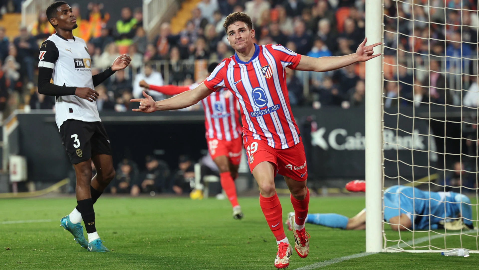 Alvarez double takes Atletico top with Valencia win