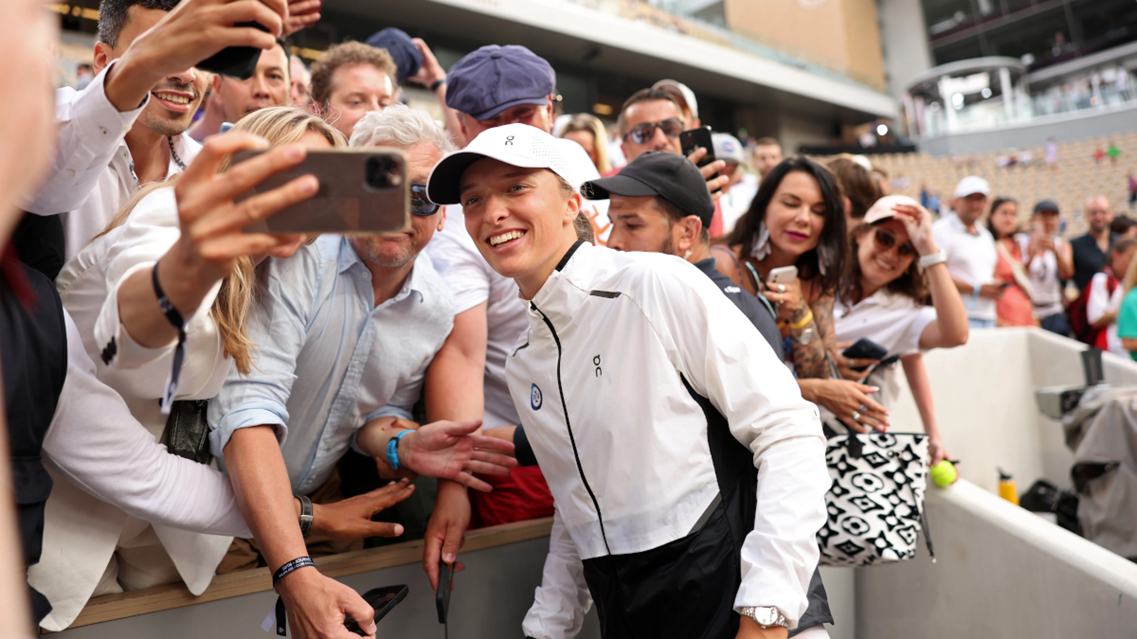 Rockin' Rafa fan Swiatek on top of the world