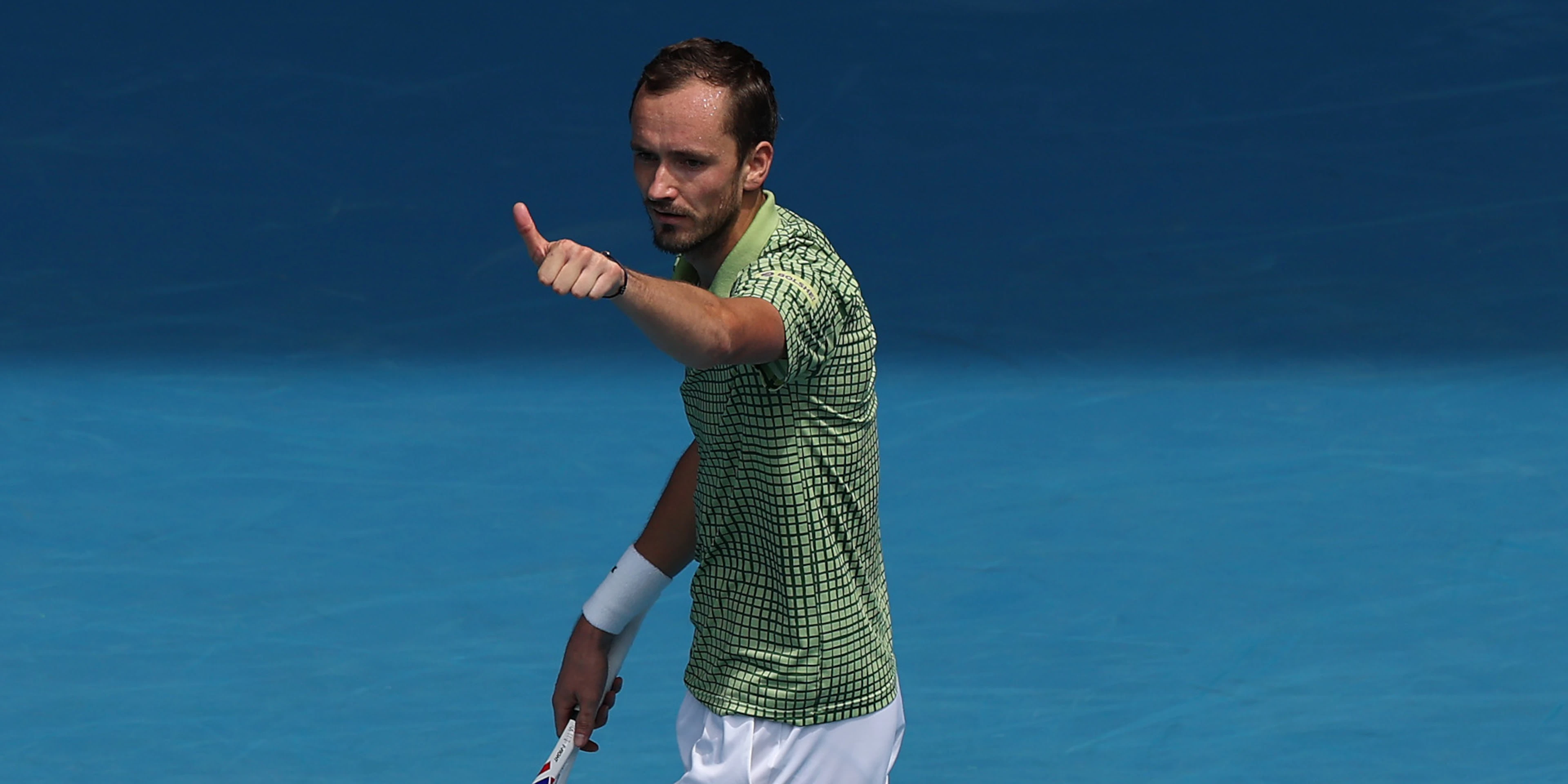 Medvedev grinds into Aus Open round two, Auger-Aliassime retires injured
