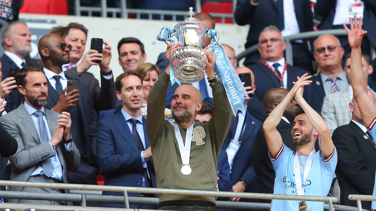 Guardiola urges City players to seize treble chance