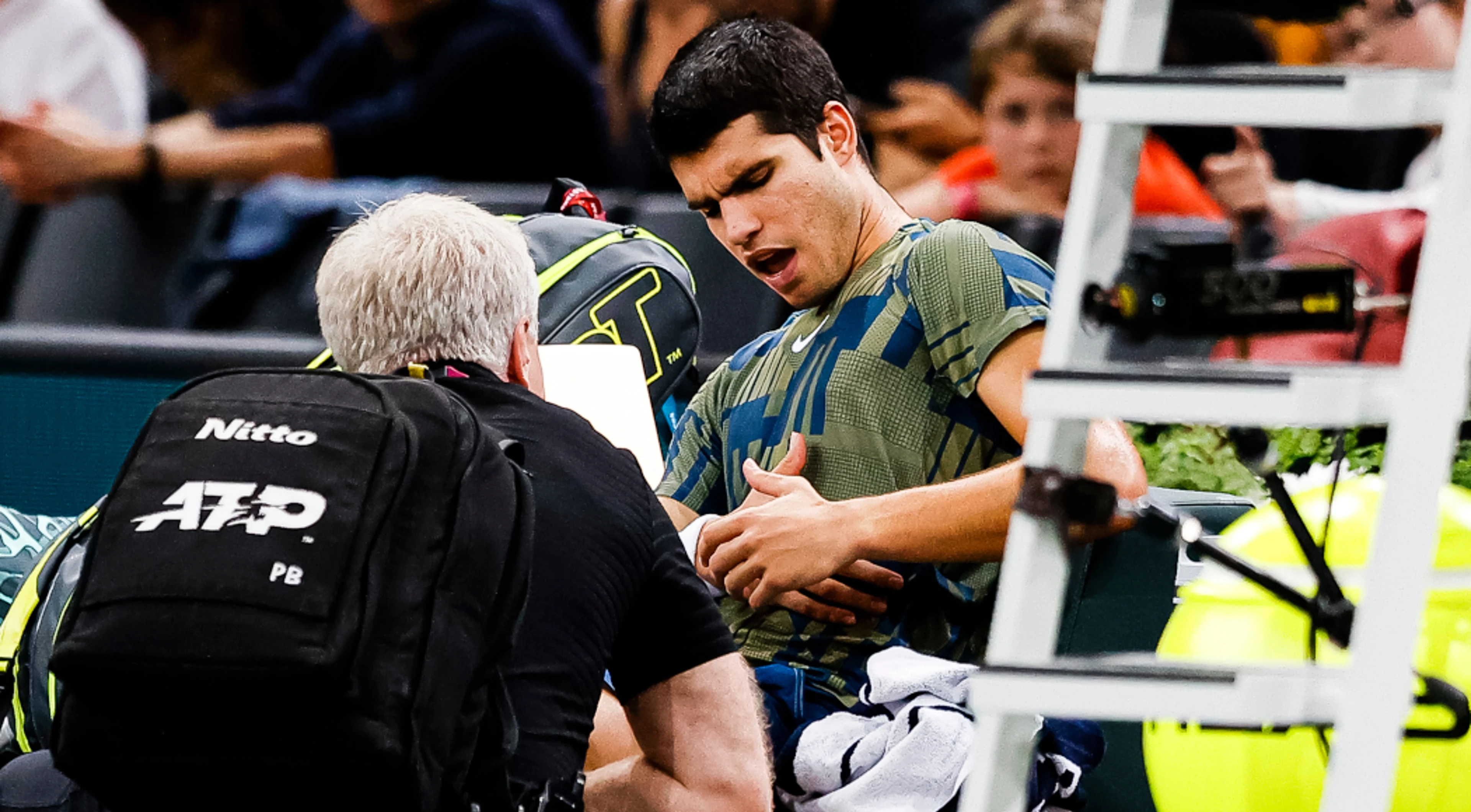 Alcaraz retires with injury as Djokovic races into semis