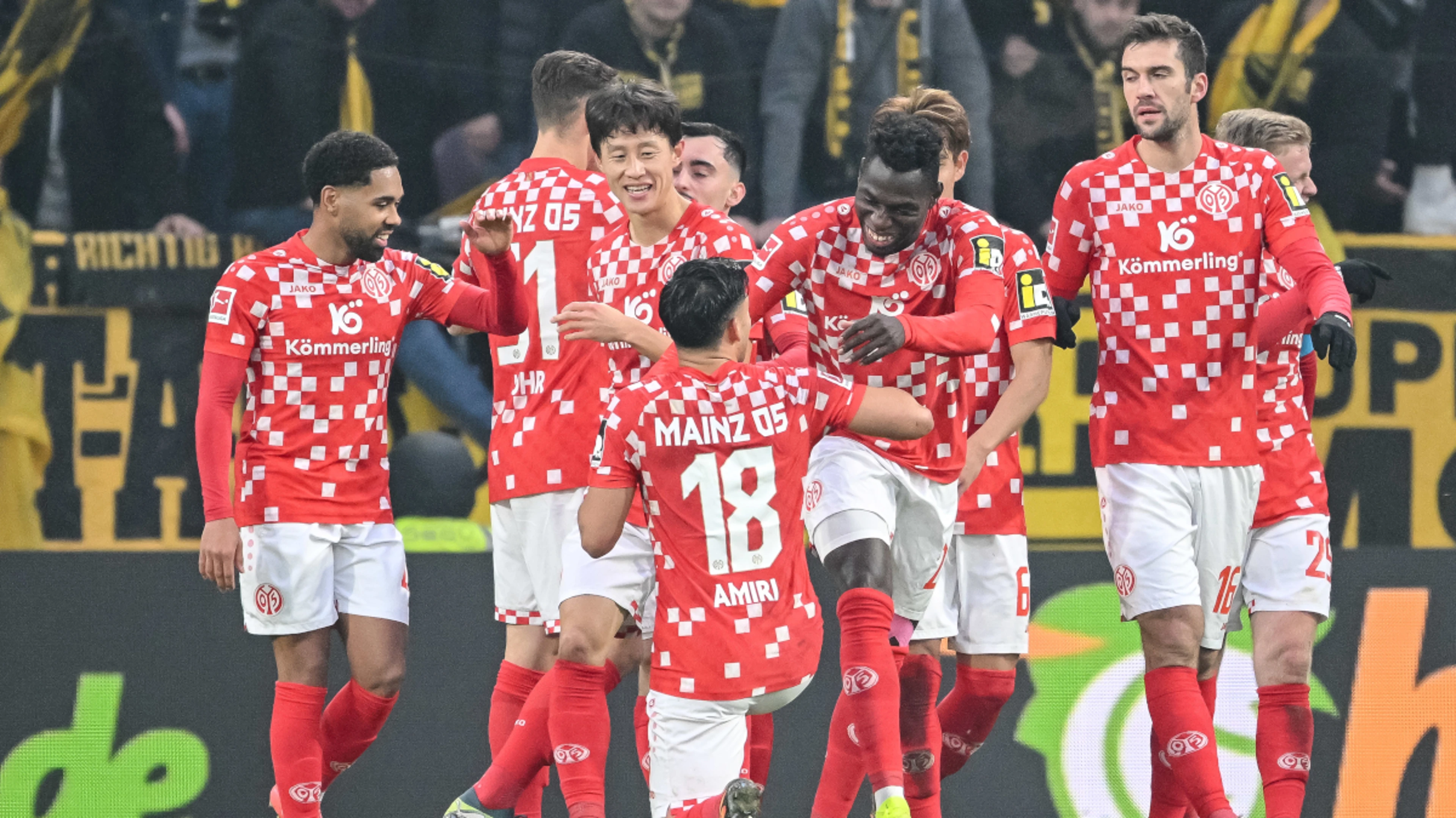 Ten-man Dortmund slump to  loss at Mainz