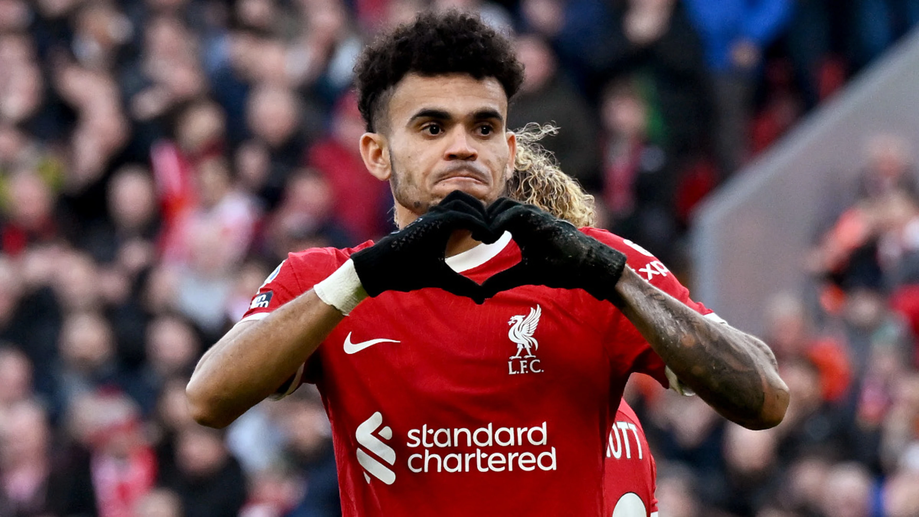 Liverpool survive Burnley scare to regain top spot