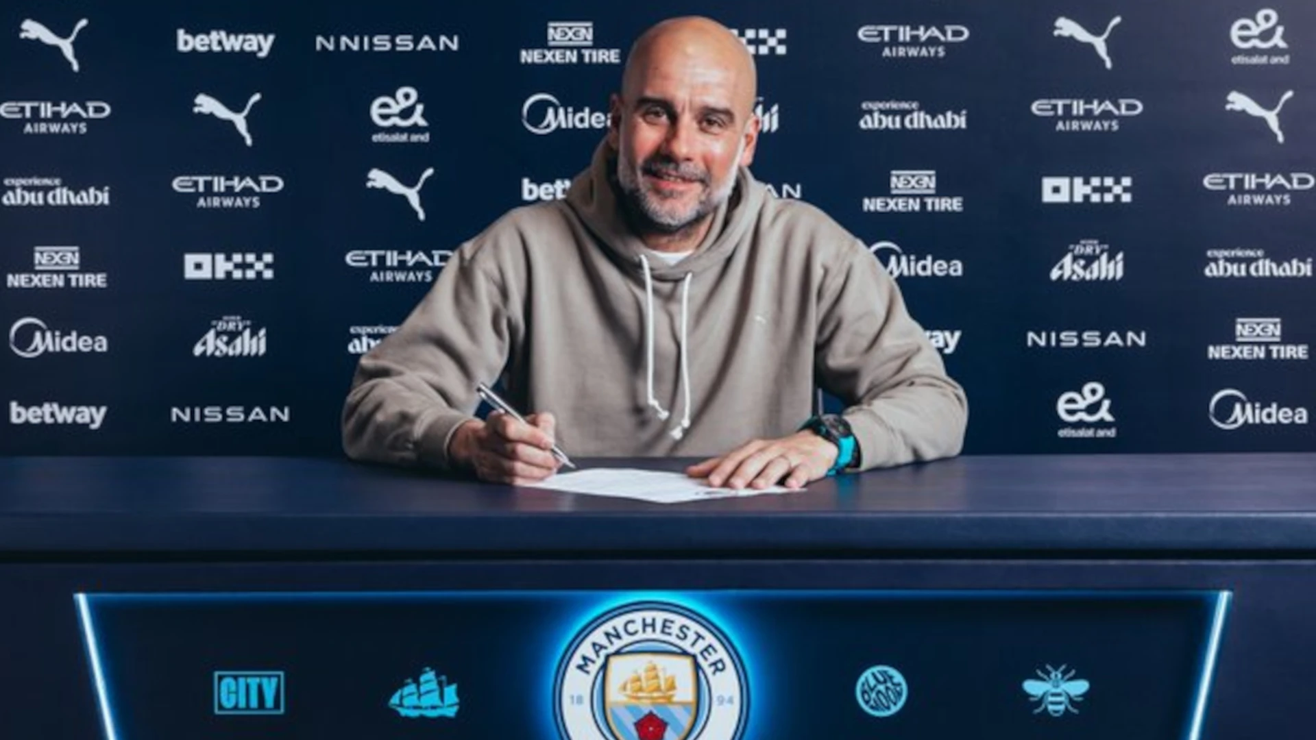 Manchester City manager Guardiola signs new two-year contract