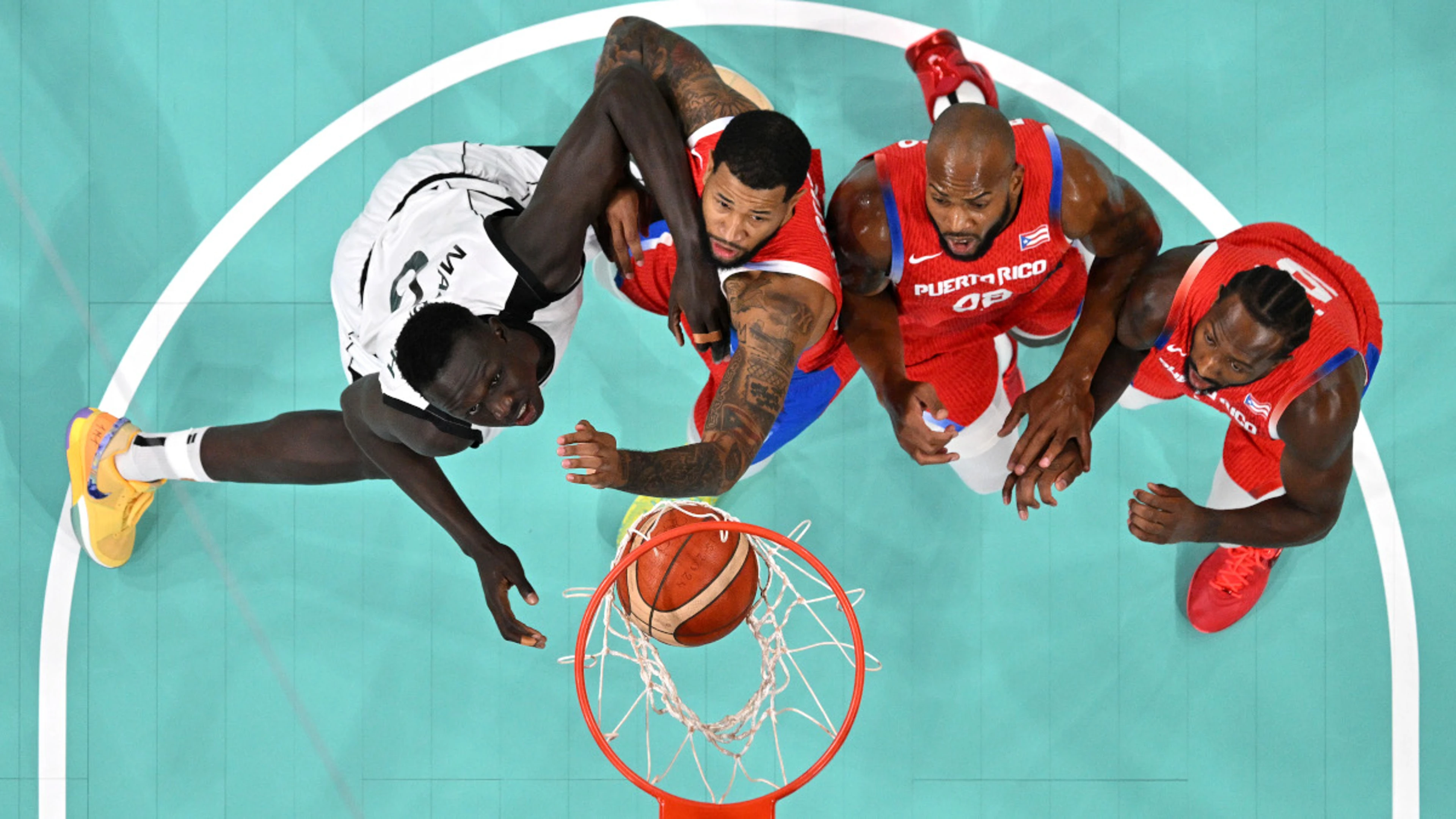 South Sudan overcome Puerto Rico, Spain edge out China