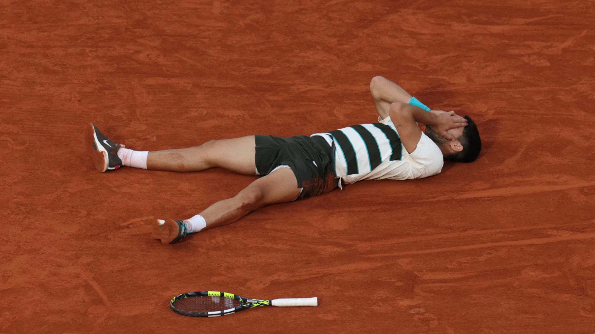 Alcaraz saves three match points to beat Sinner to French Open title