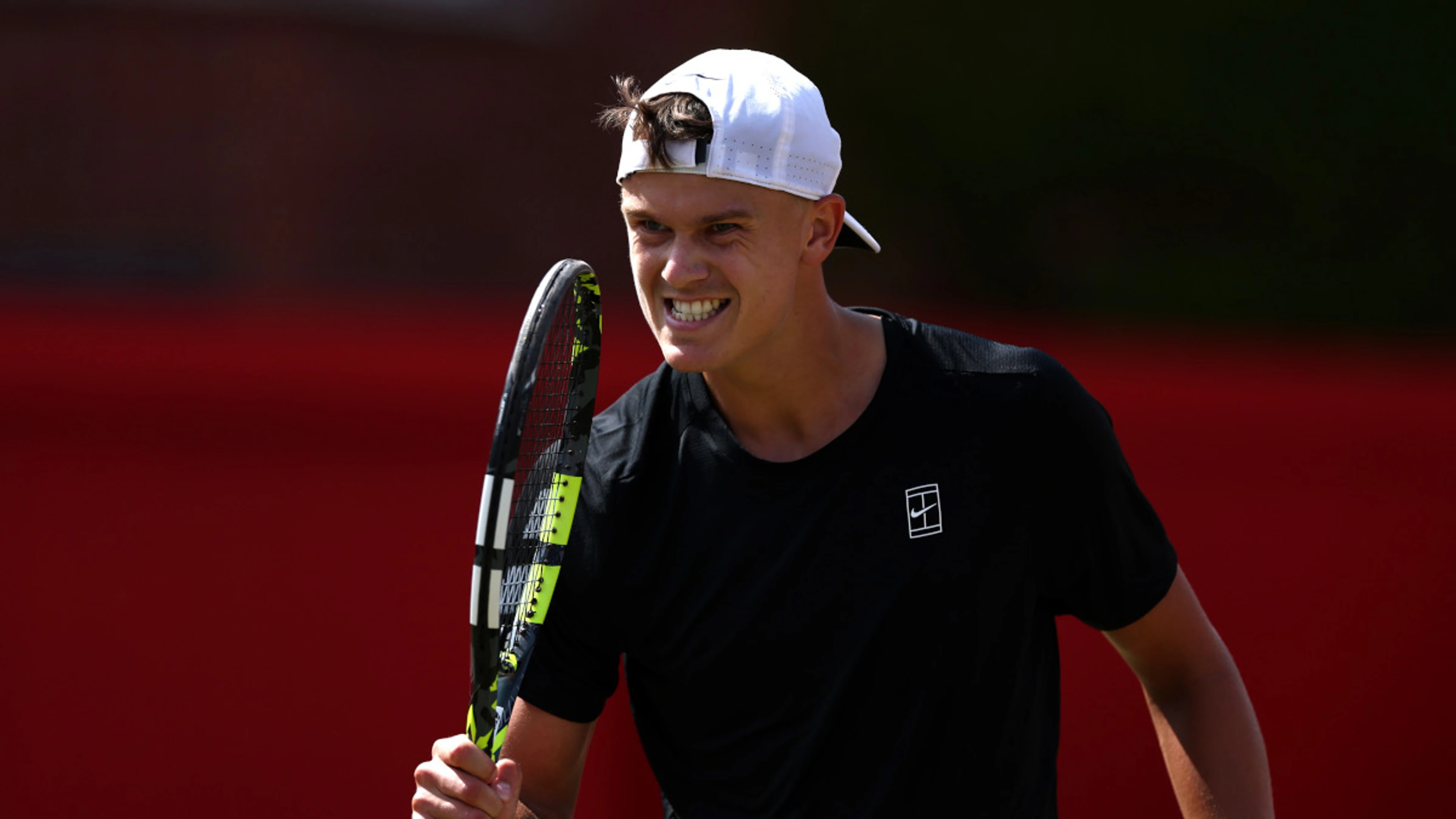 Tiafoe crashes out, Rune cruises through at Queen's Club