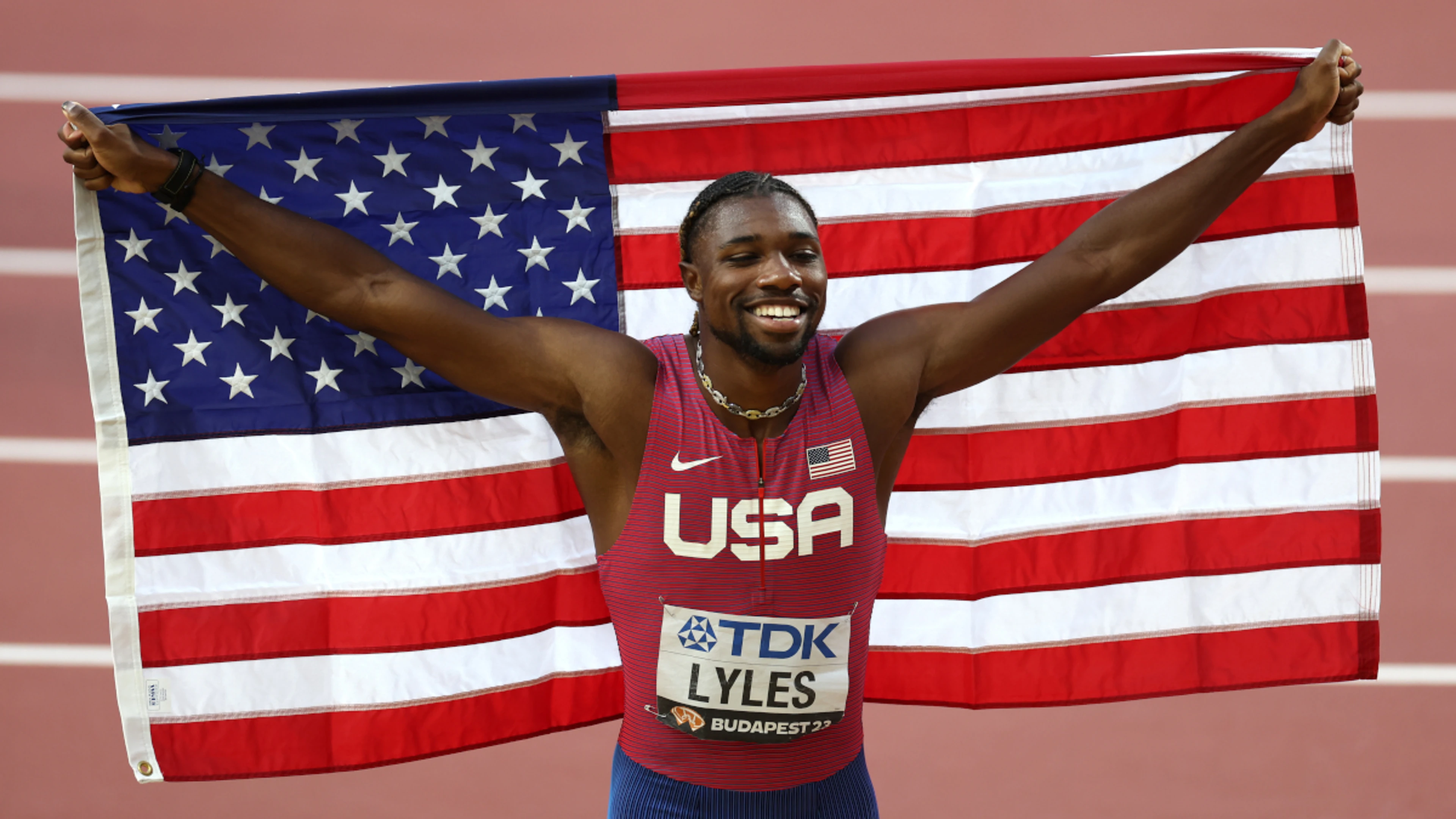 Lyles strikes 100m gold to extend US dominance