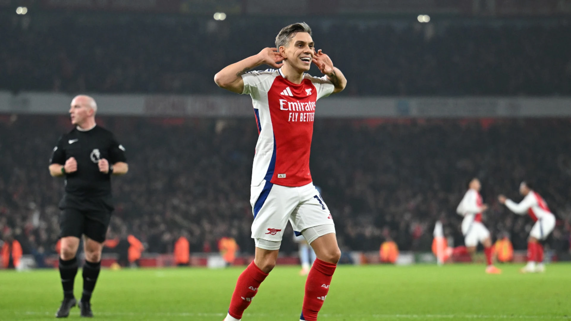 Arsenal fightback sinks Spurs to ignite title bid