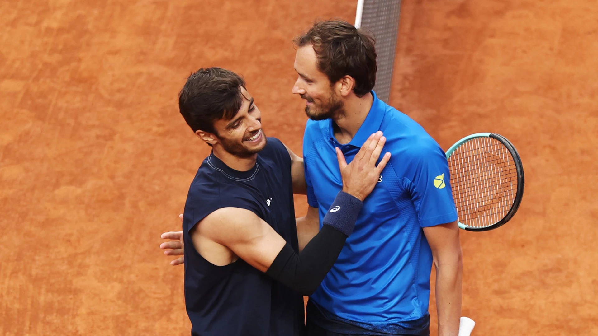 Musetti battles Medvedev and match-point rain delay to reach Rome quarters