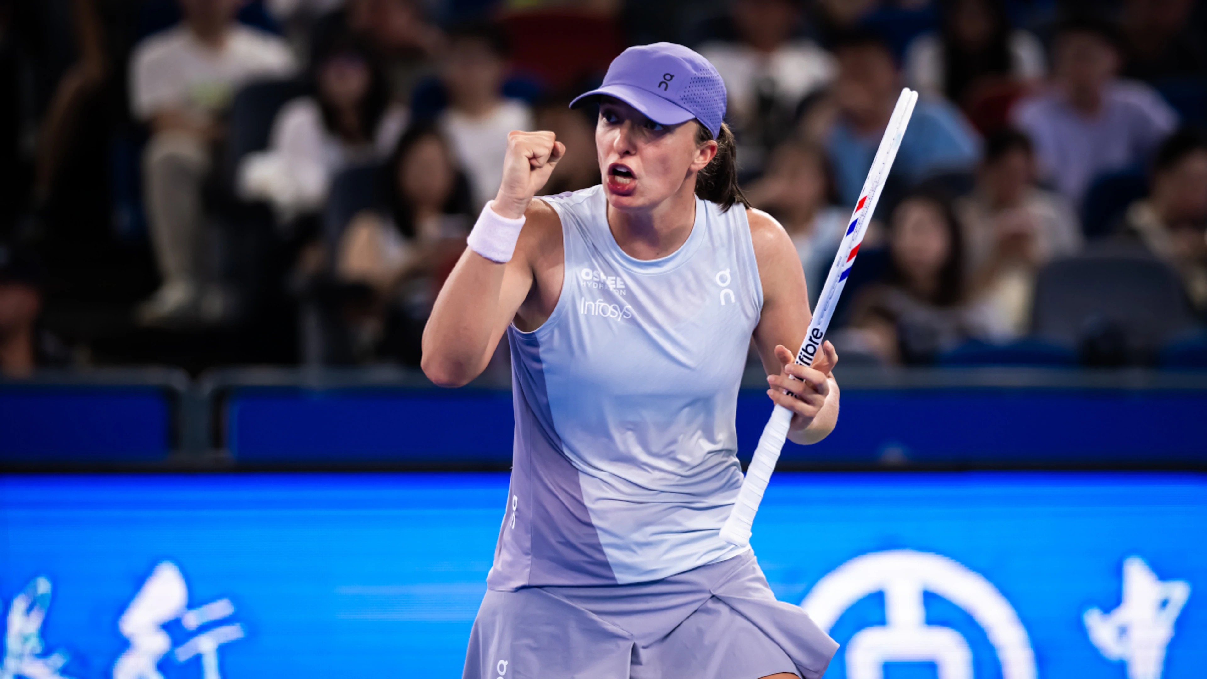 Swiatek coasts through Wuhan debut while heat wilts players