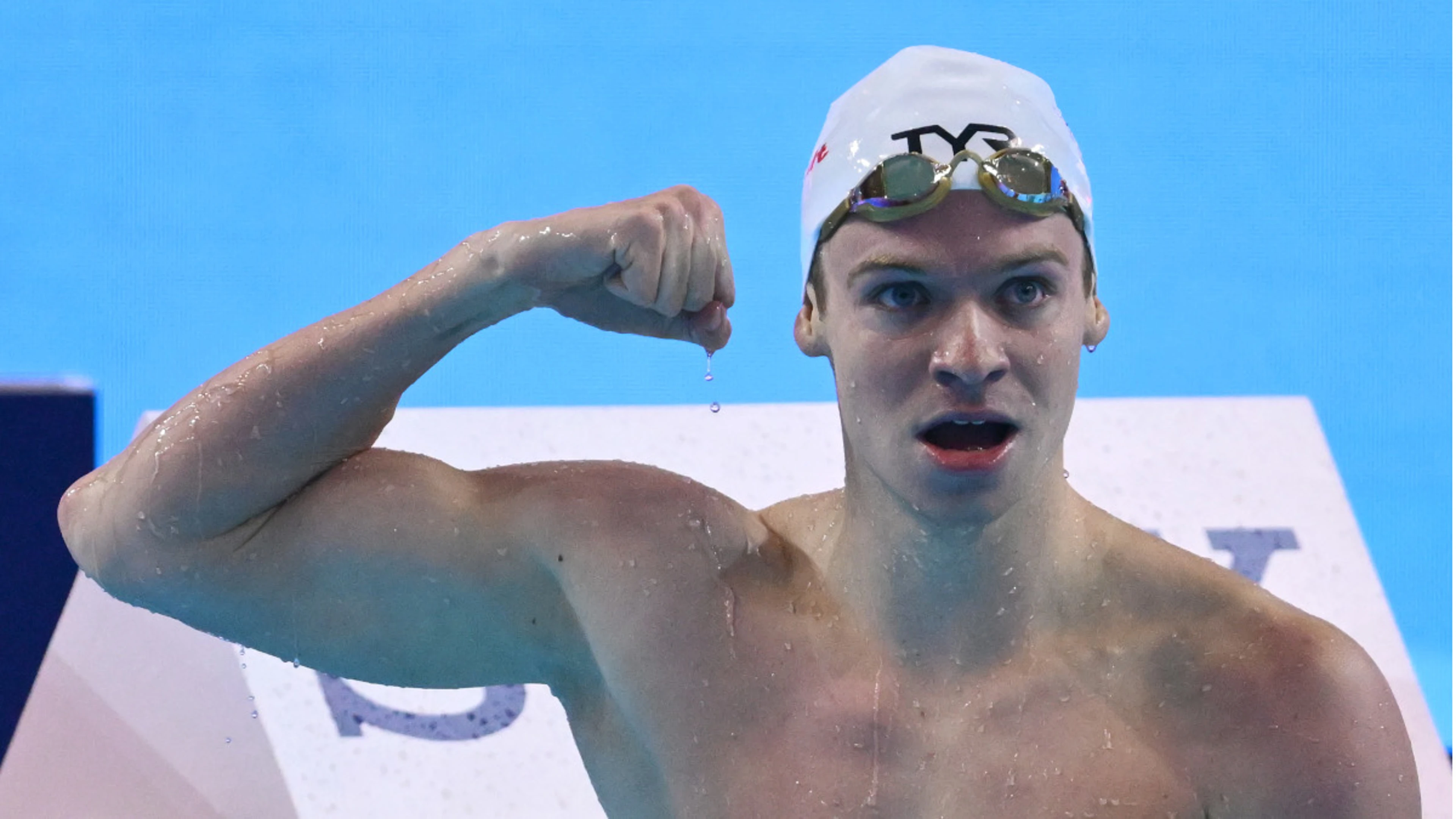 Marchand shatters record as US, Australia win more world gold