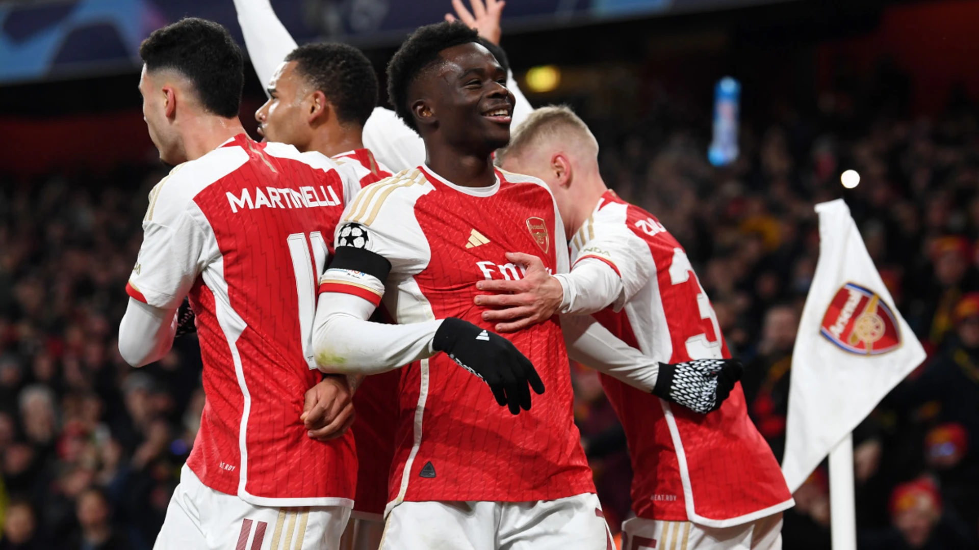 Arsenal hit Lens for six to reach Champions League last 16