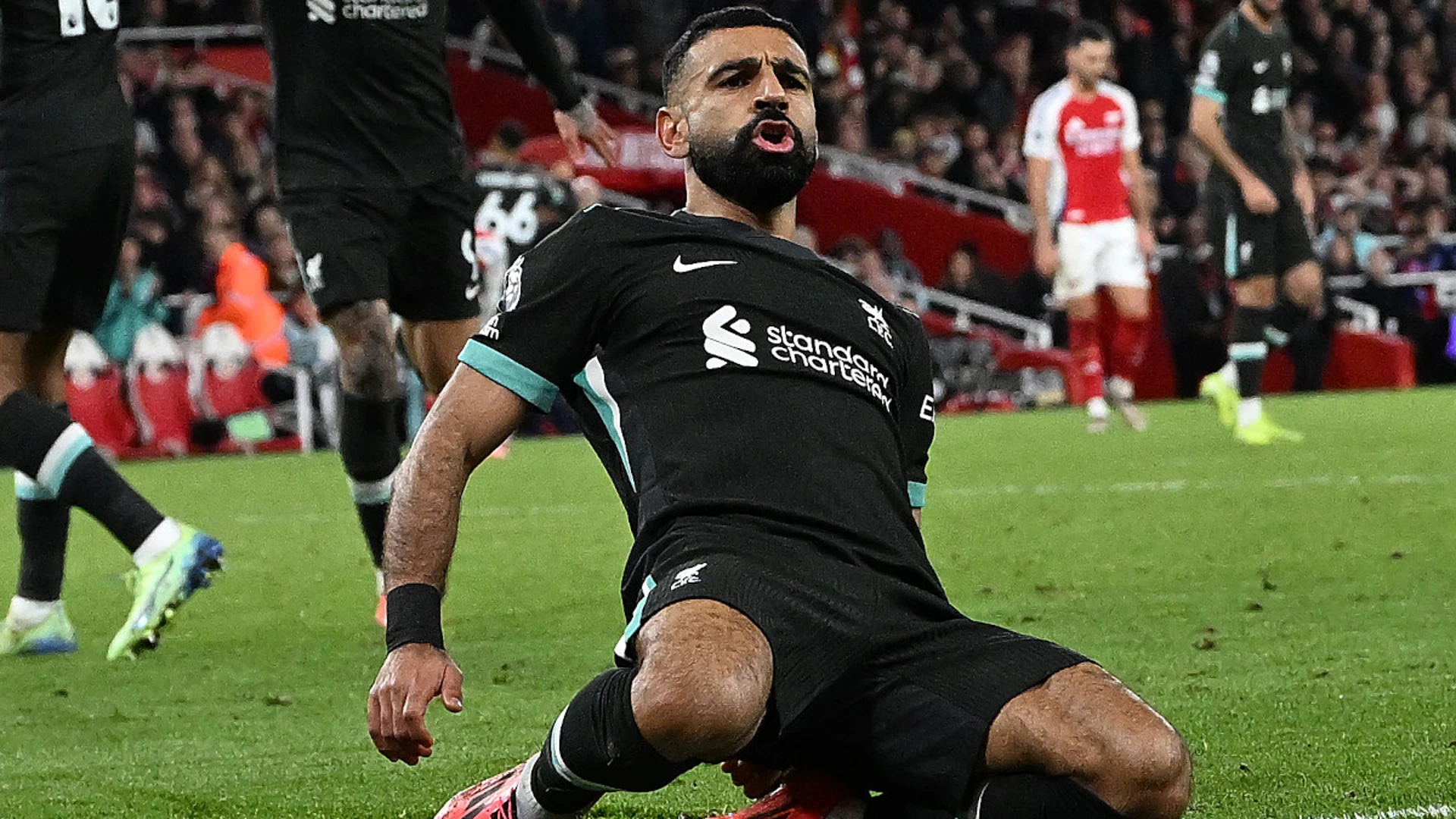 Salah strike hands Liverpool Premier League draw at Arsenal