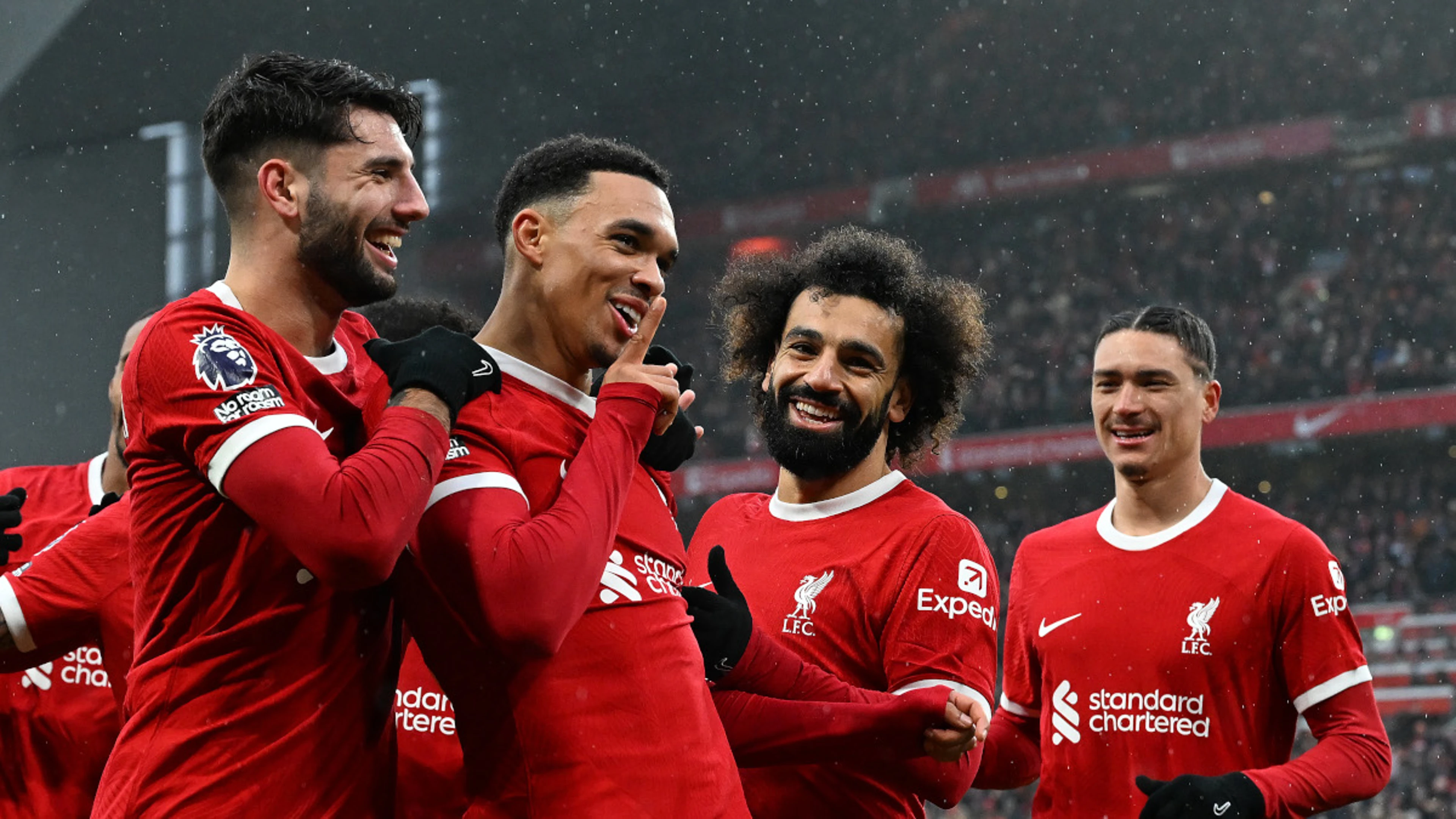 Liverpool hit late double to preserve Premier League home record