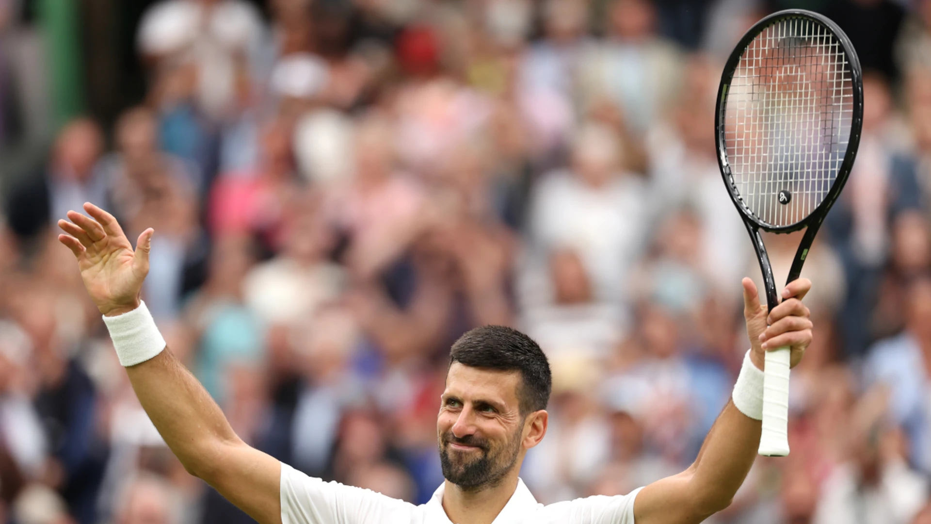 Djokovic shrugs off injury fears to reach Wimbledon second round