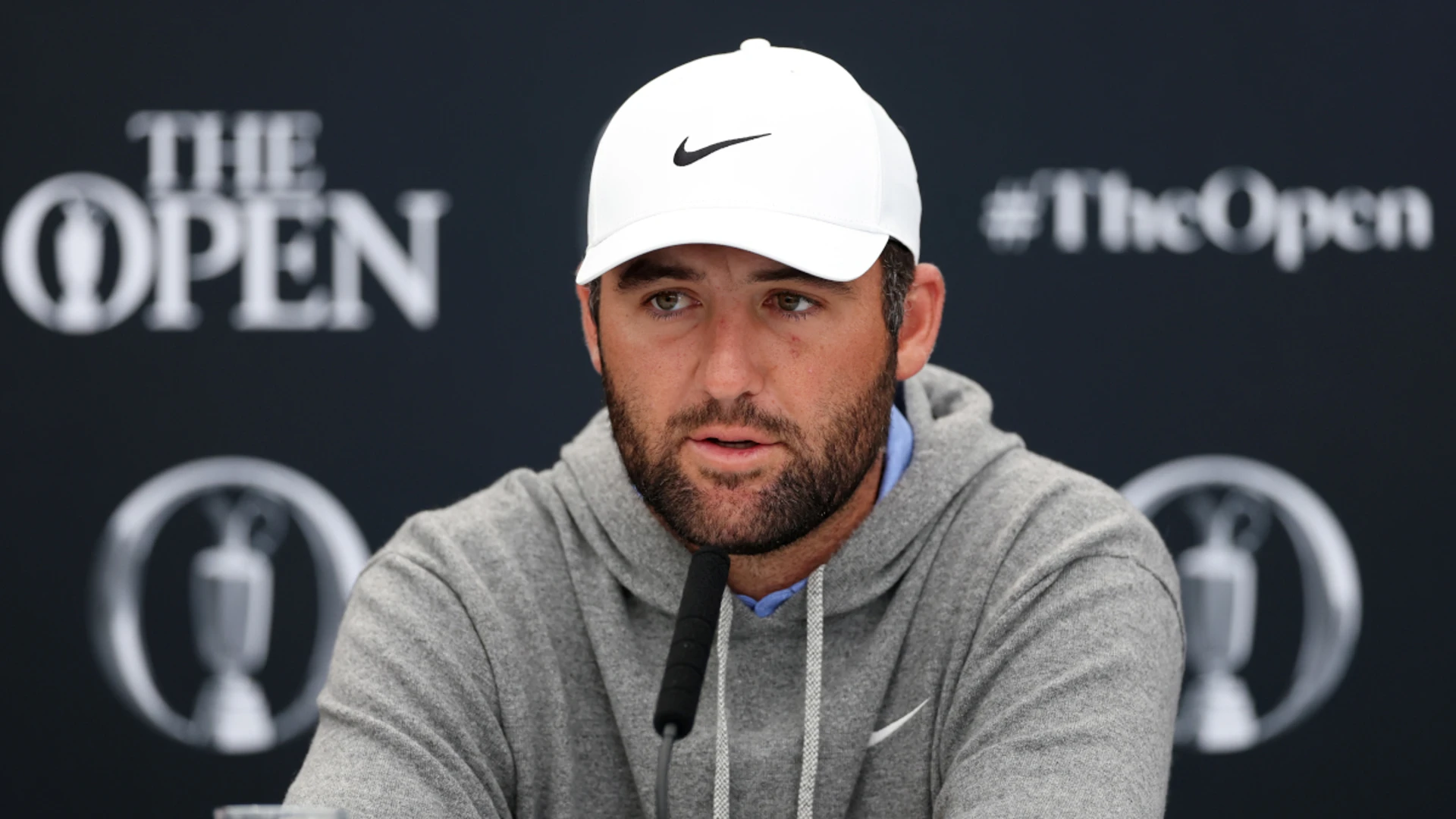 Soaked Scheffler battles elements to make solid British Open start