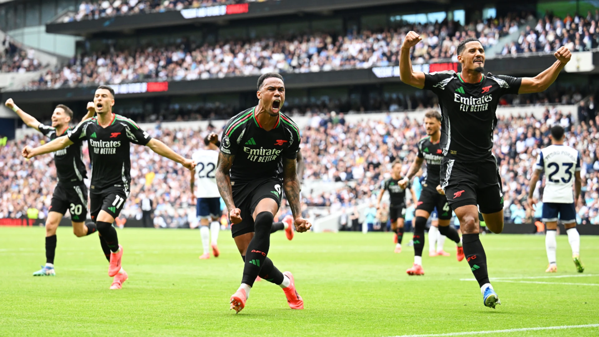 Gabriel's header earns Arsenal the win at Spurs in feisty derby