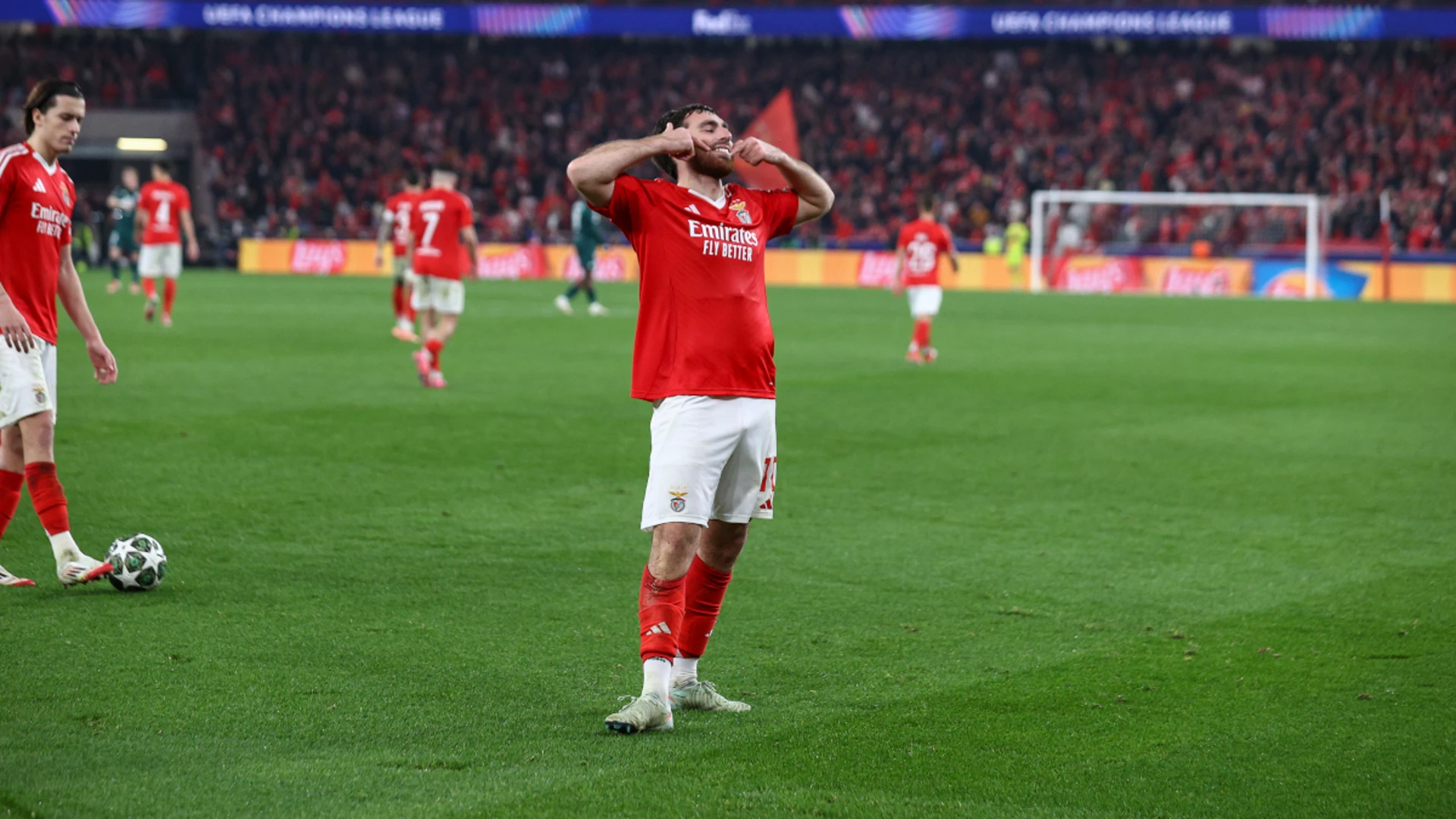 Benfica hold off Monaco in thriller to reach Champions League last 16