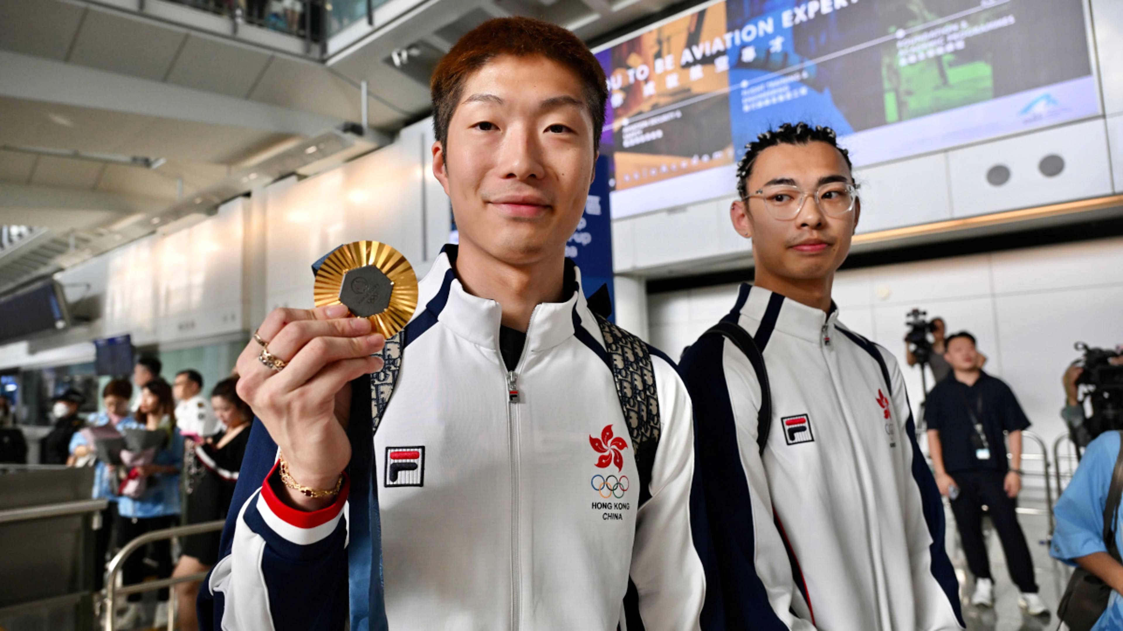 Hong Kong's Fencing Olympian Cheung returns home to rapturous cheers
