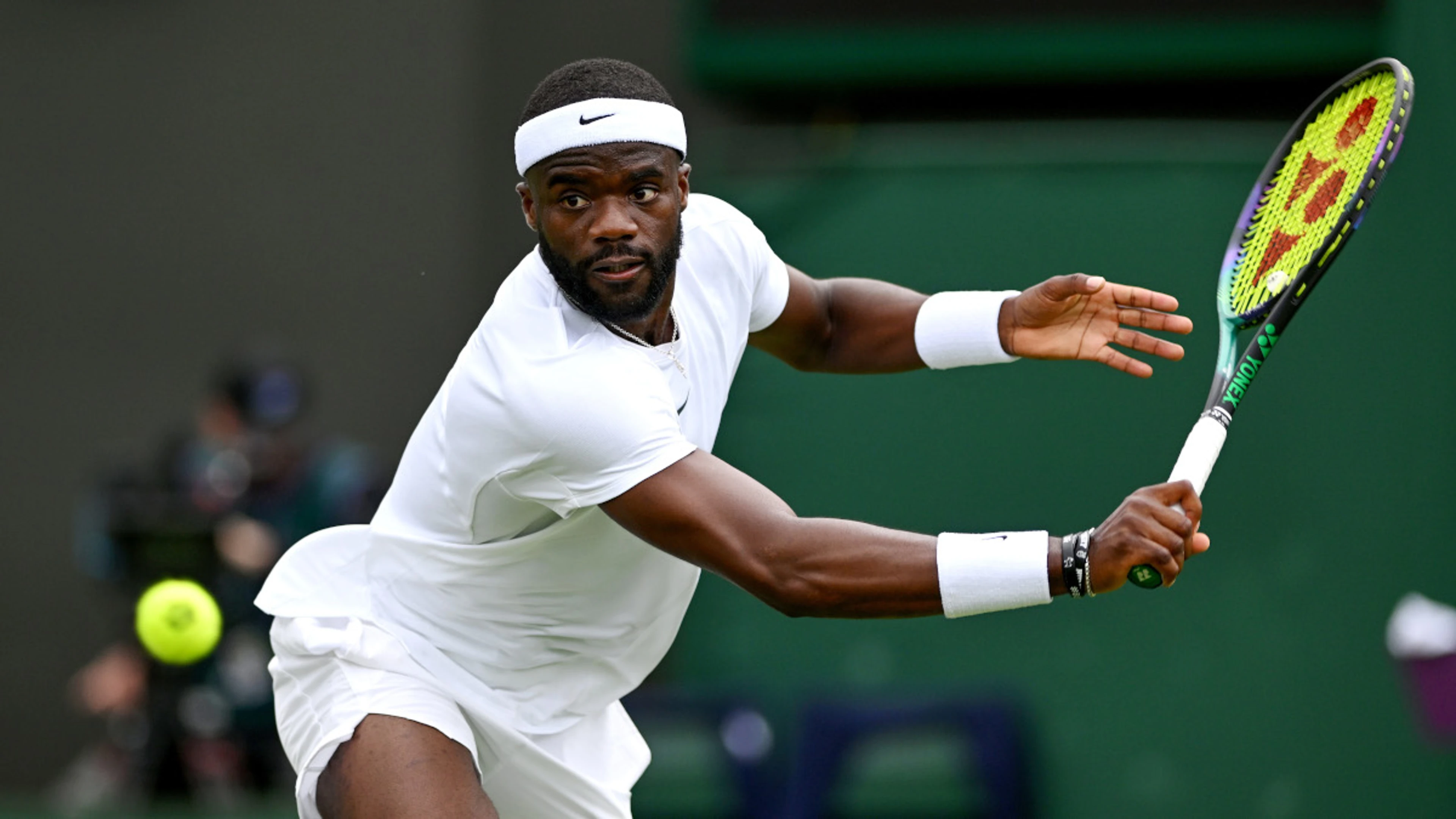 Tiafoe fends off Wu to advance, Djokovic through