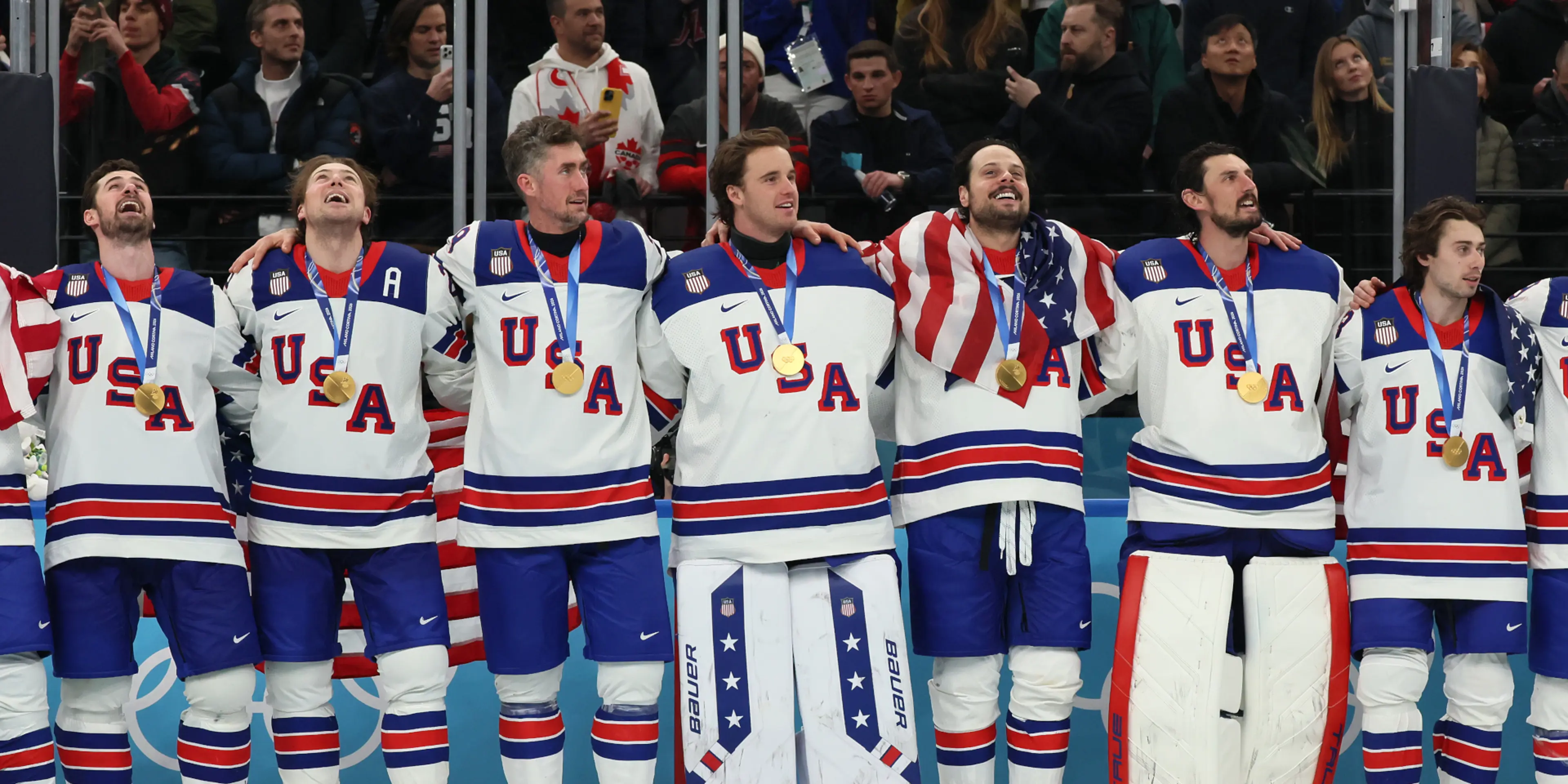 Gu strikes gold, USA beat Canada in men's ice hockey