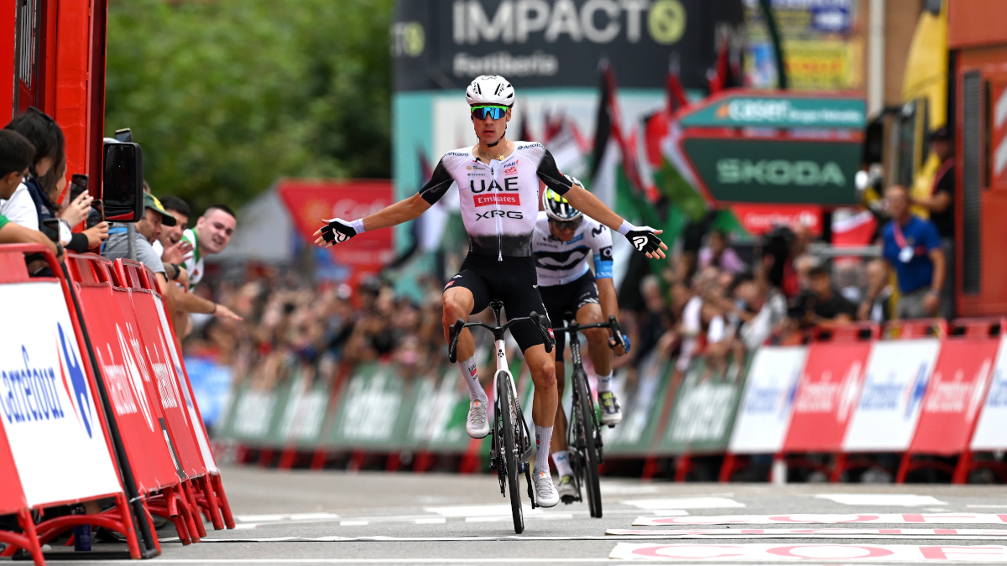 Ayuso sprints to Vuelta stage 12 victory as tensions ease