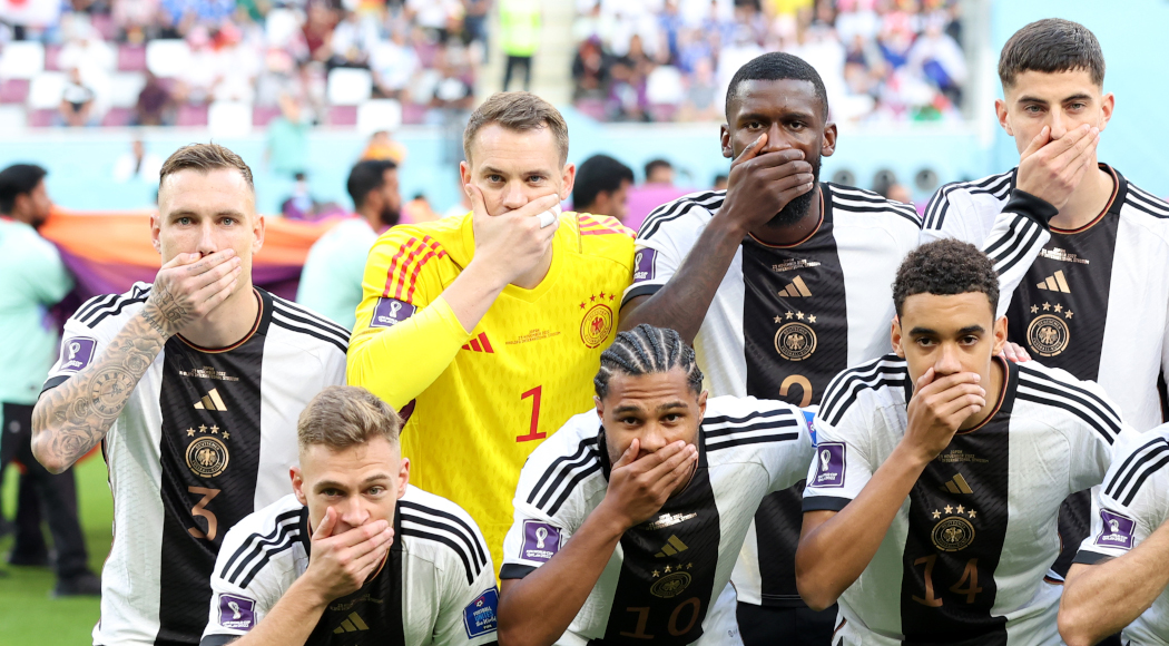 Germany players cover mouths in protest for photo