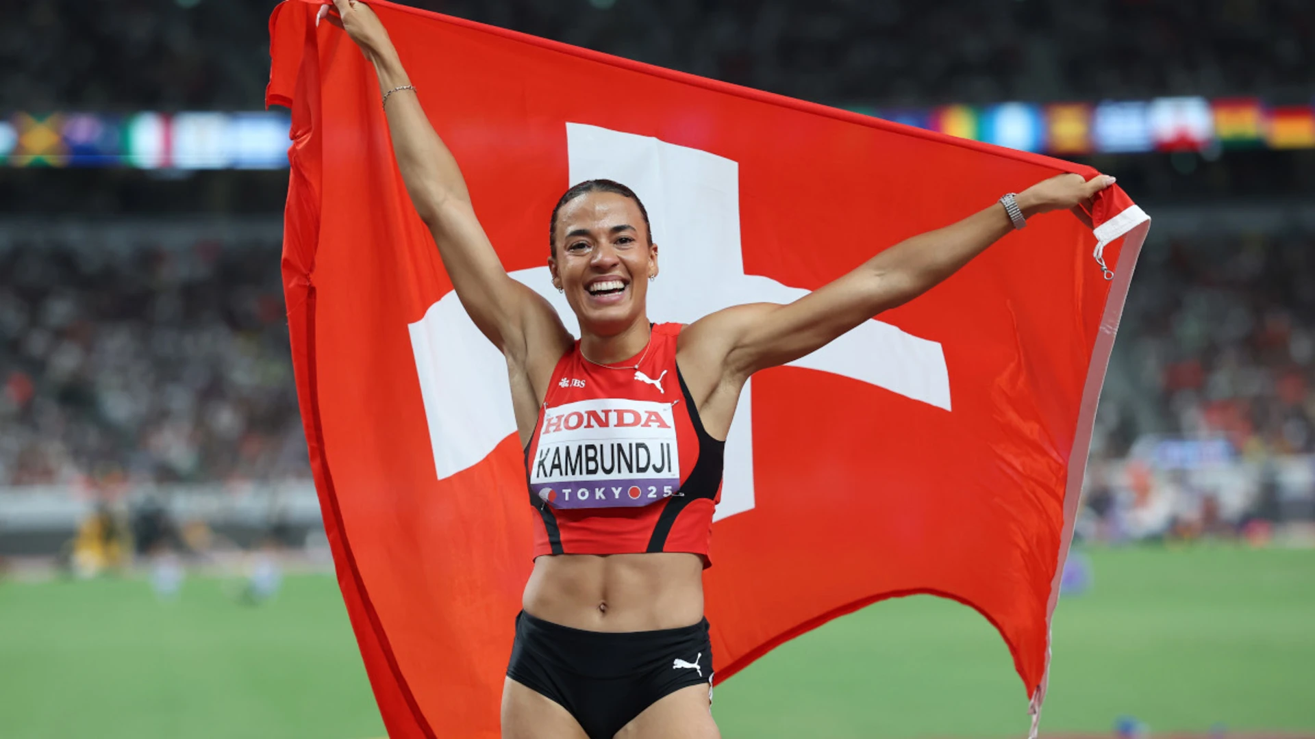 Switzerland's Kambundji storms to shock world 100m hurdles win