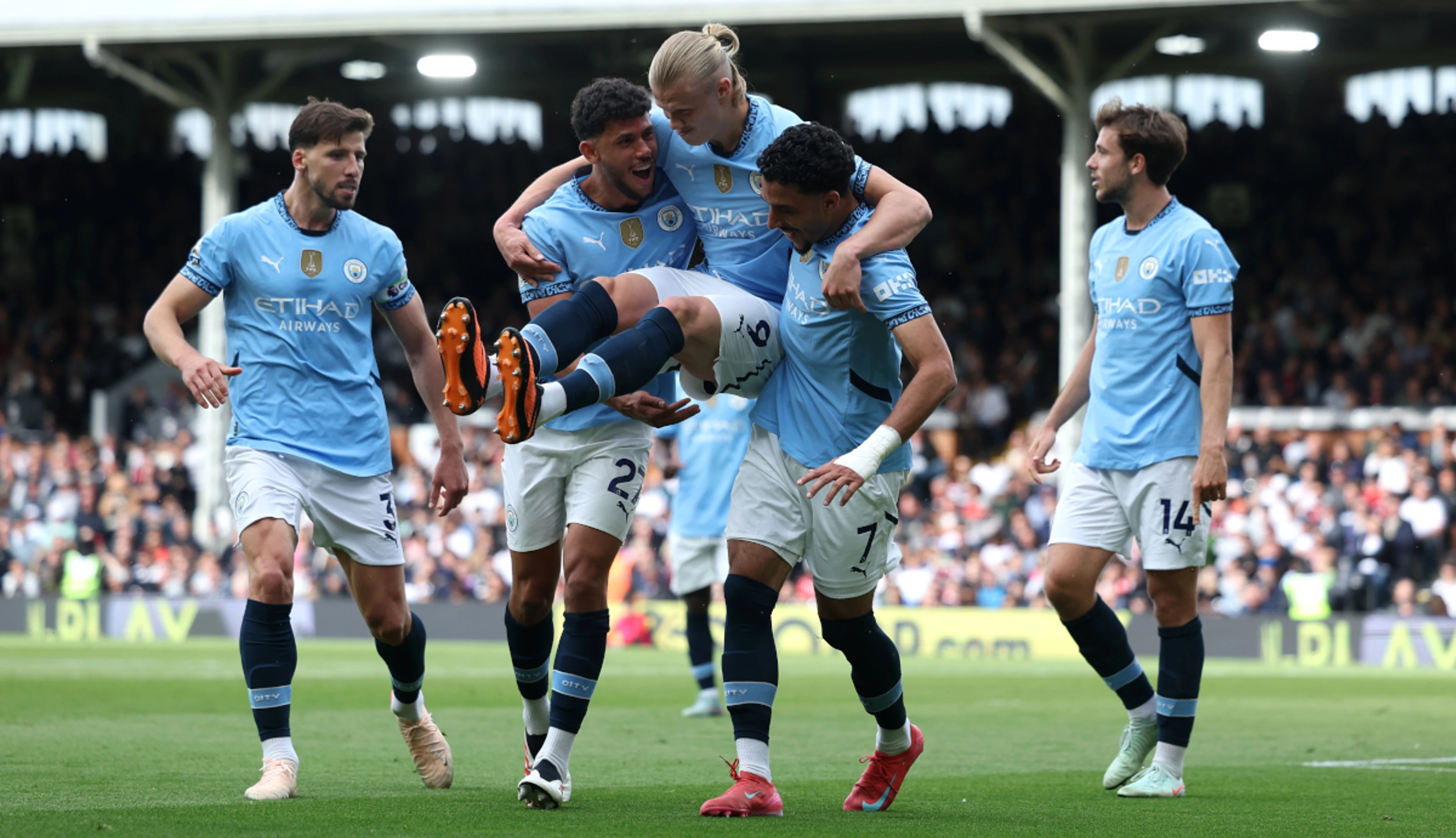 Manchester City book Champions League place with win at Fulham