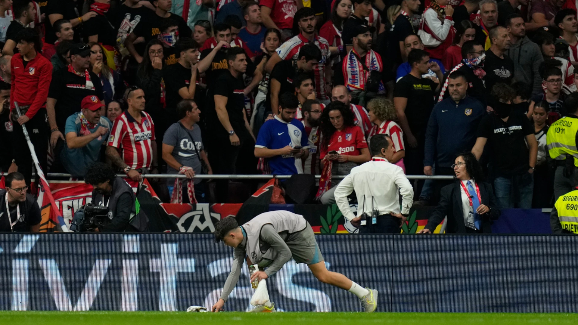 Madrid derby suspended after Atletico fans throw objects