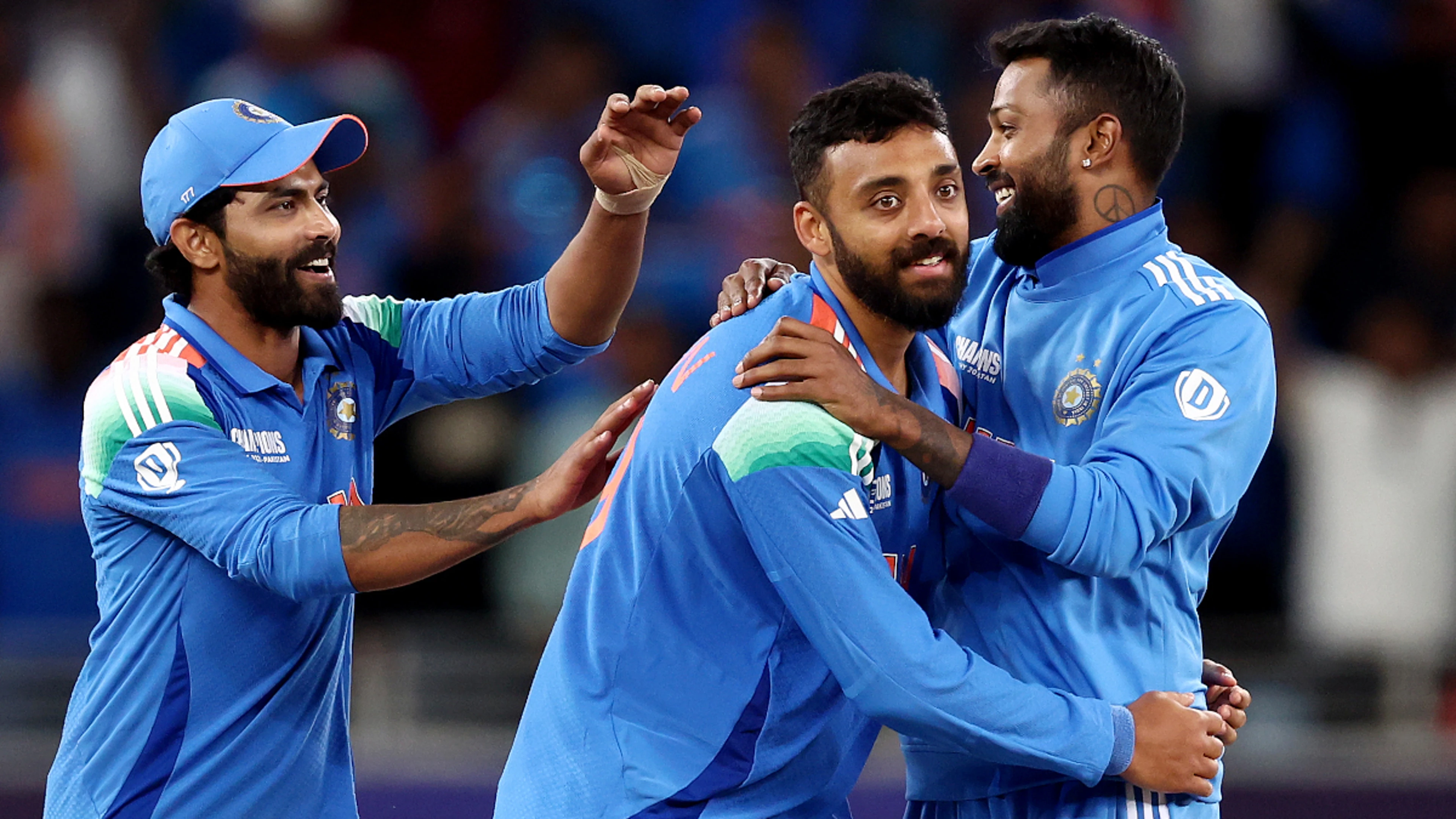 Chakravarthy stars as India set up Champions Trophy clash with Australia