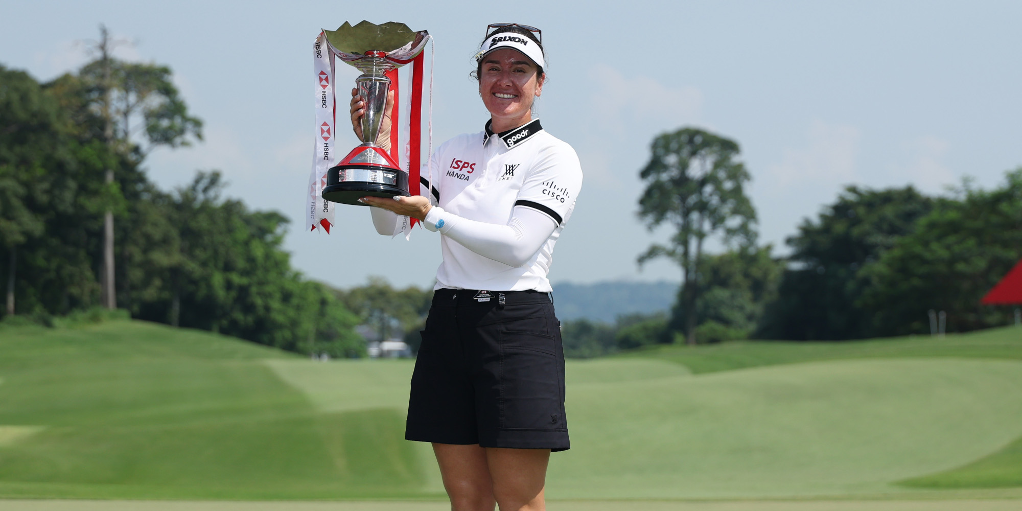 Green clinches Singapore title with help from caddie husband