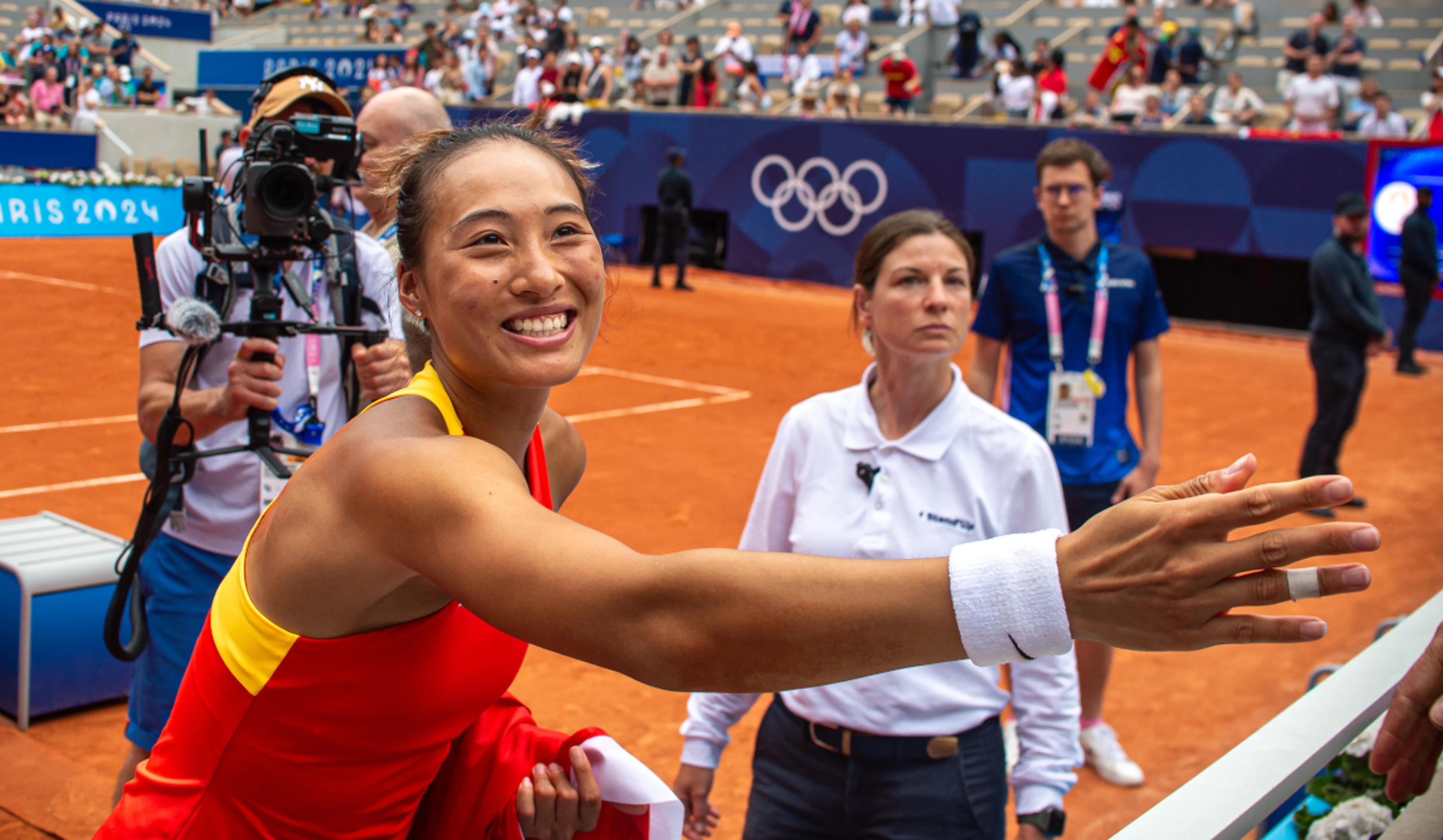 Zheng credits parents' tough love for Olympic gold