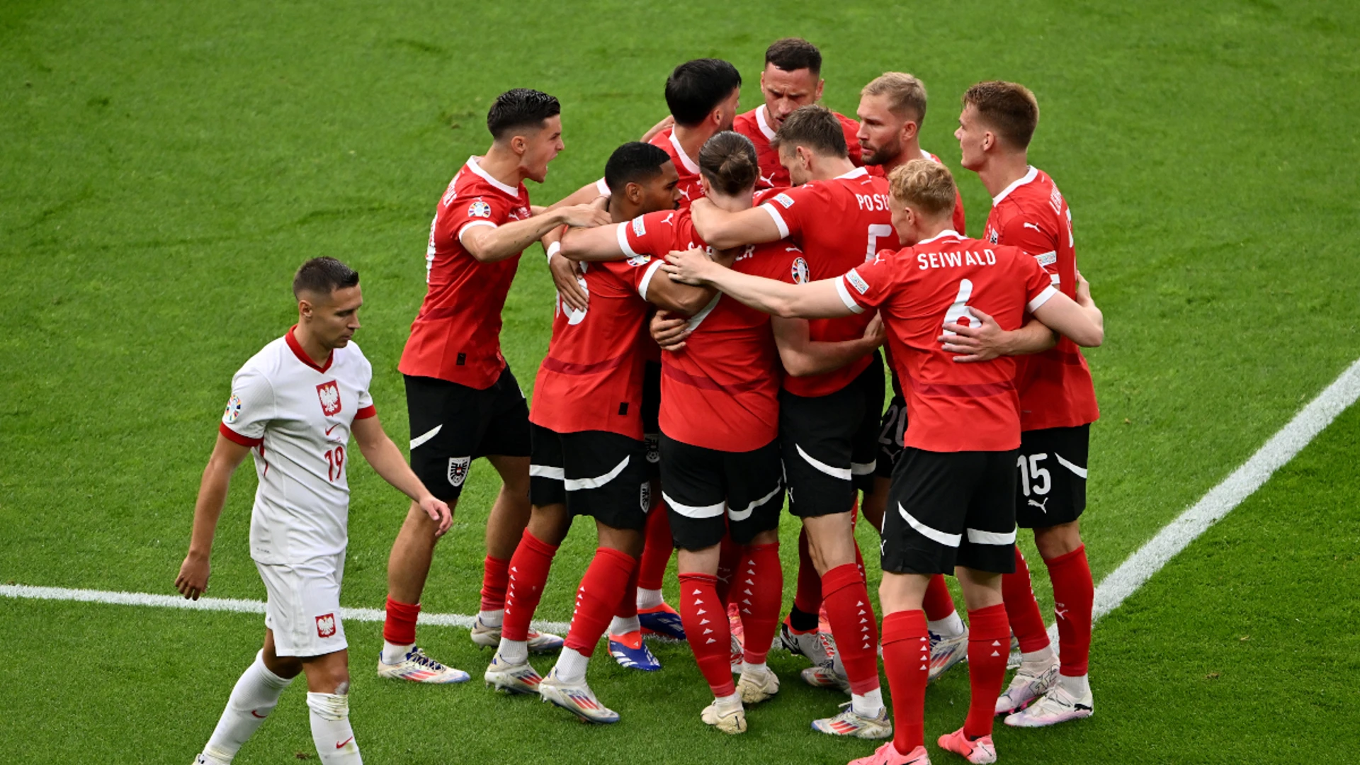 Austria ease past Poland to renew knockout stage hopes