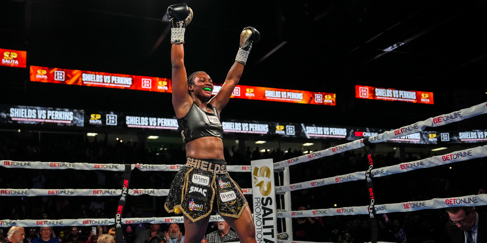 Two-time Olympic champ defends undisputed heavyweight crown