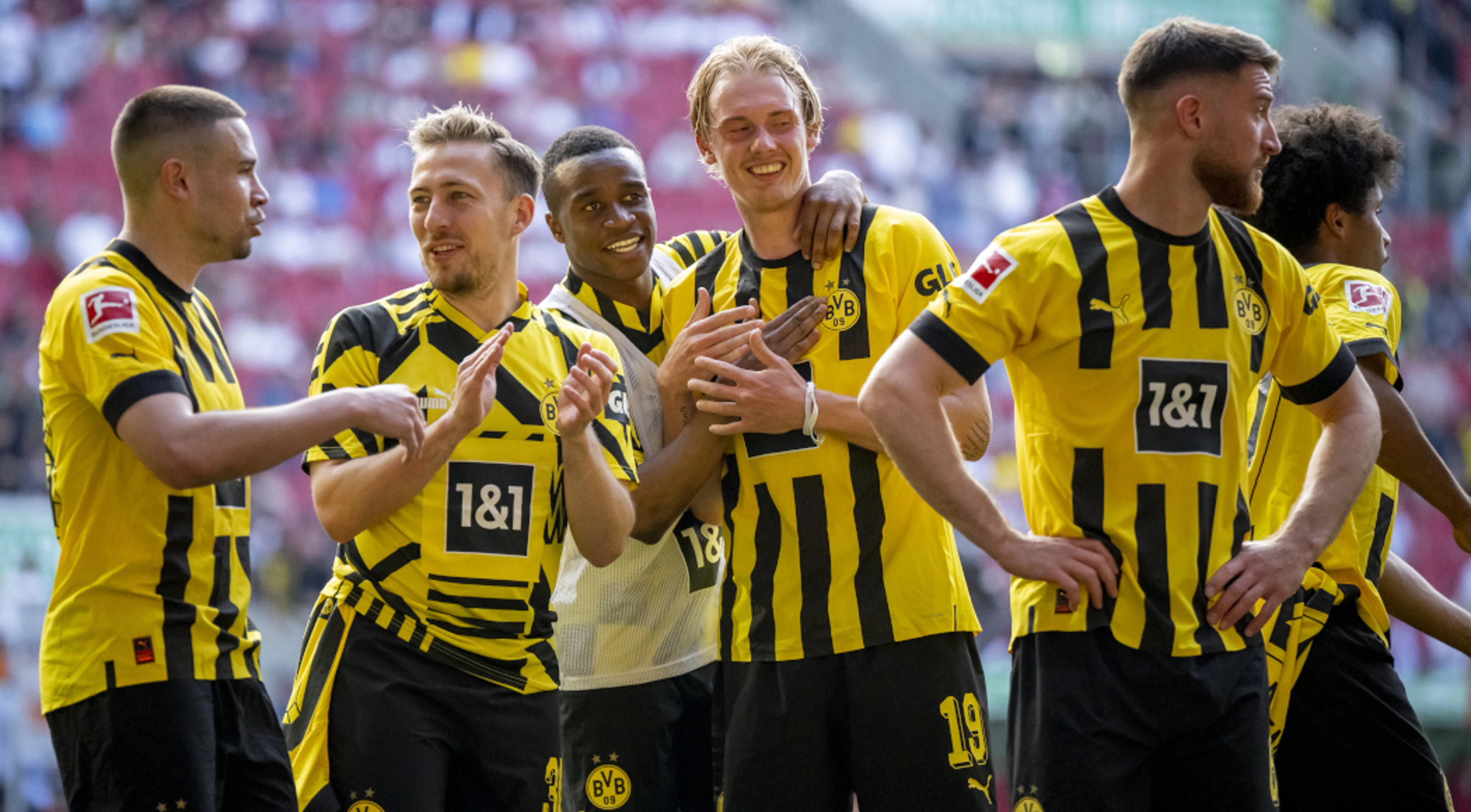 Dortmund keep lid on euphoria as title race goes to the wire