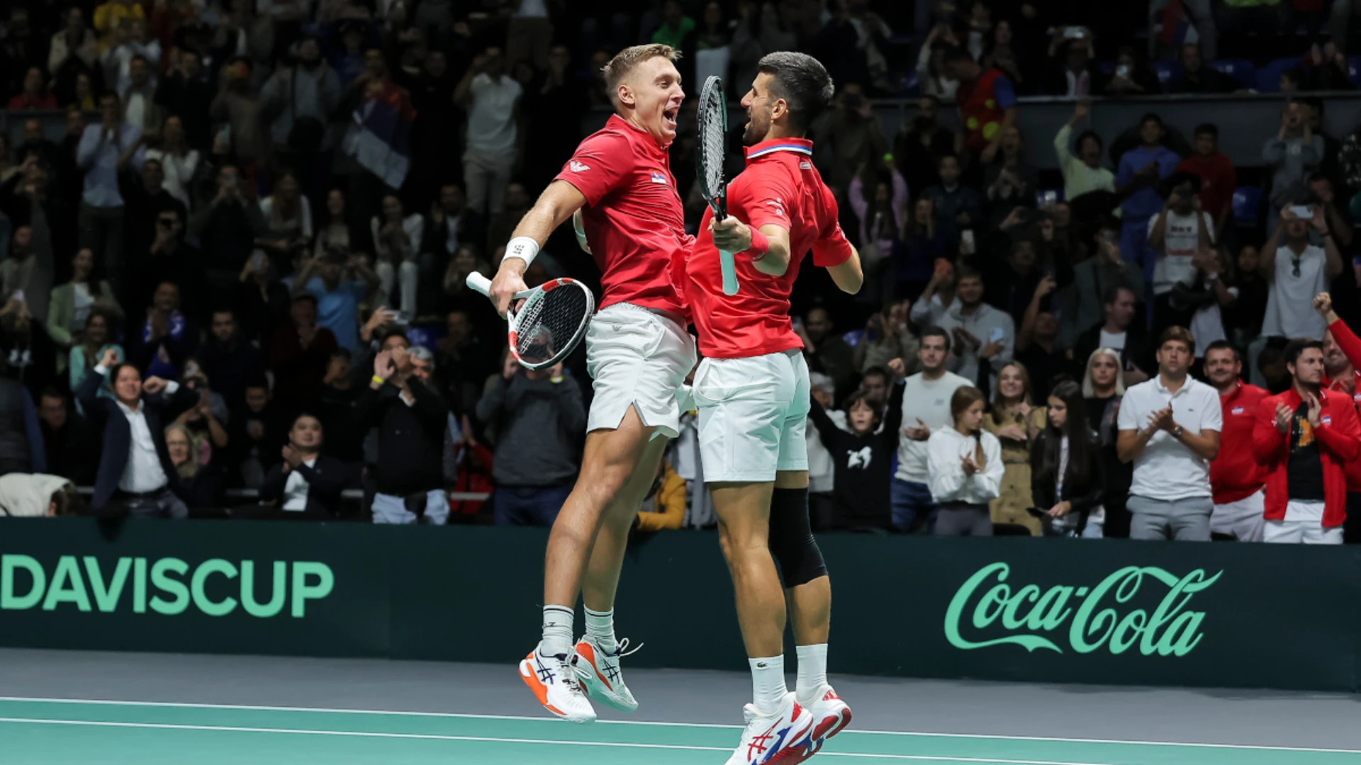 Doubles win for Djokovic secures Serbia's Davis Cup status