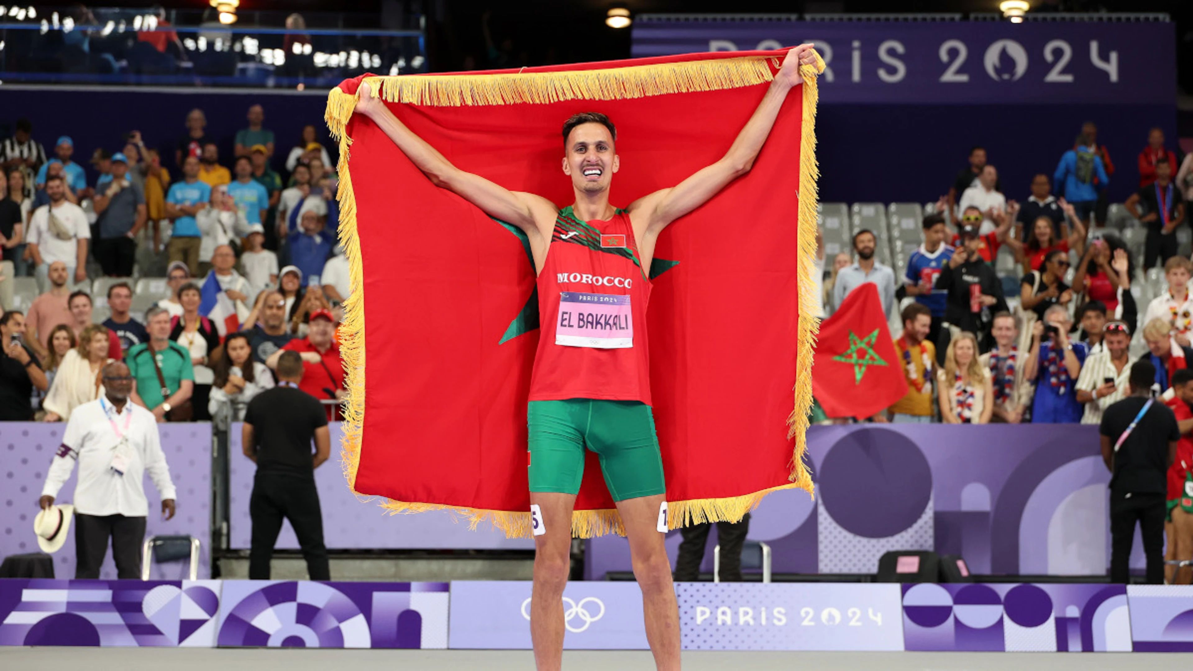 El Bakkali retains Olympic steeplechase title as Girma suffers bad fall