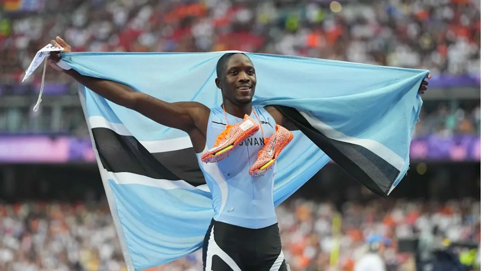 HERO'S WELCOME: Flags and dancing as Botswana welcomes home Olympic gold