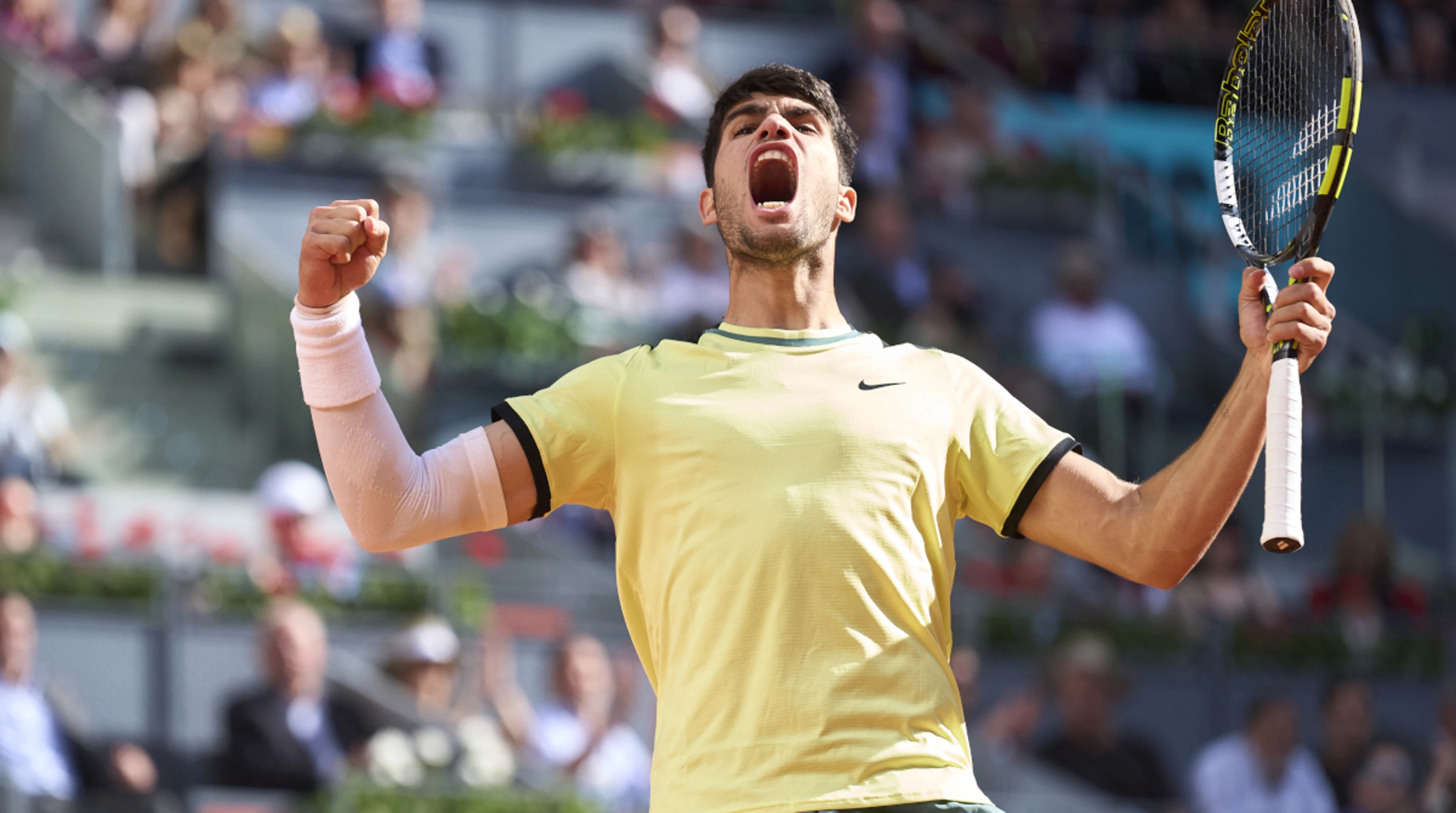 Alcaraz holds off Struff to reach Madrid quarterfinals