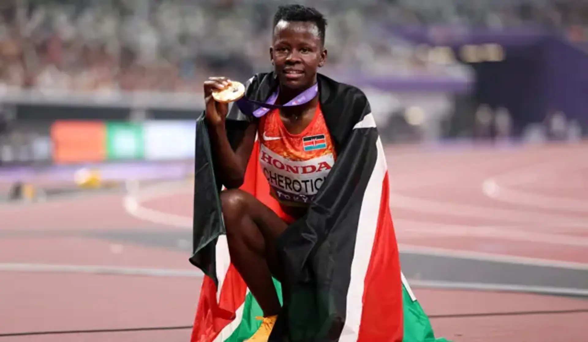 FIGHTING WIN: Cherotich overhauls Yavi for steeplechase gold